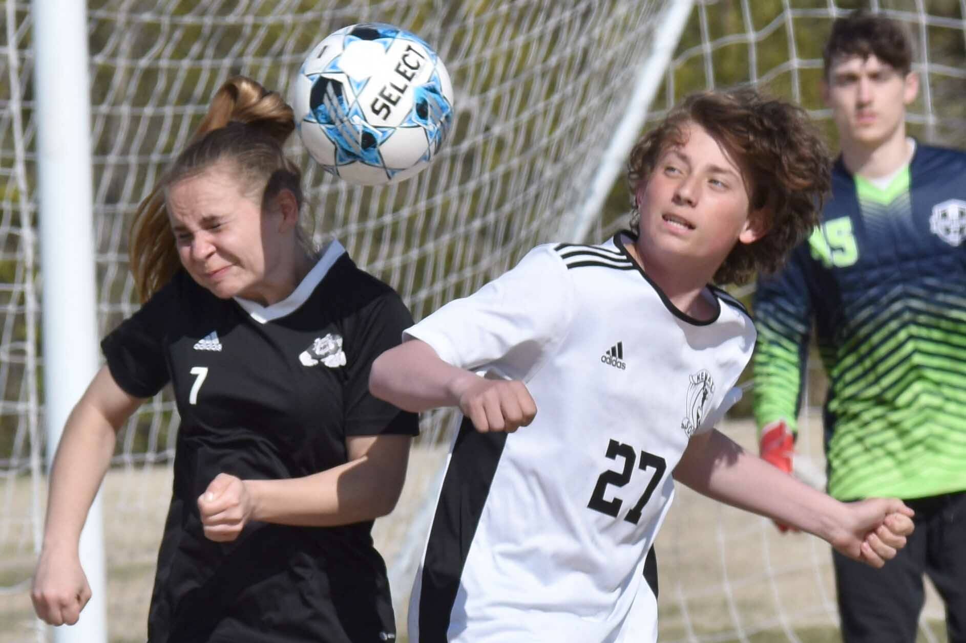Nikiski's Jayden Anderson and Kenai Central's Diego Huerta battle for the ball Friday, May 16, 2025, at Nikiski Middle-High School in Nikiski, Alaska. (Photo by Jeff Helminiak/Peninsula Clarion)