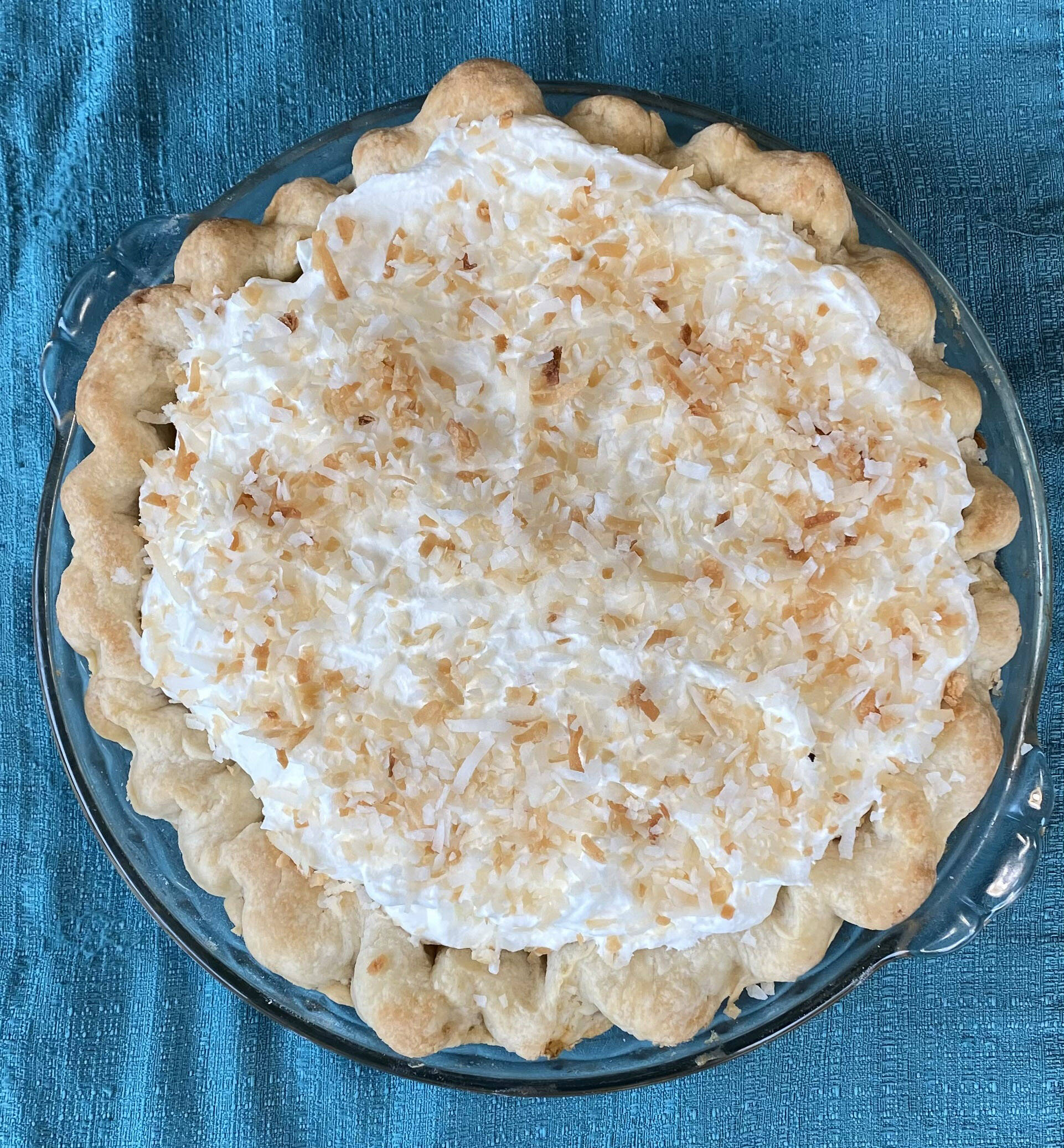 This decadent pie is made with rich coconut milk and a pile of sweetened whipped cream. (Photo by Tressa Dale/Peninsula Clarion)