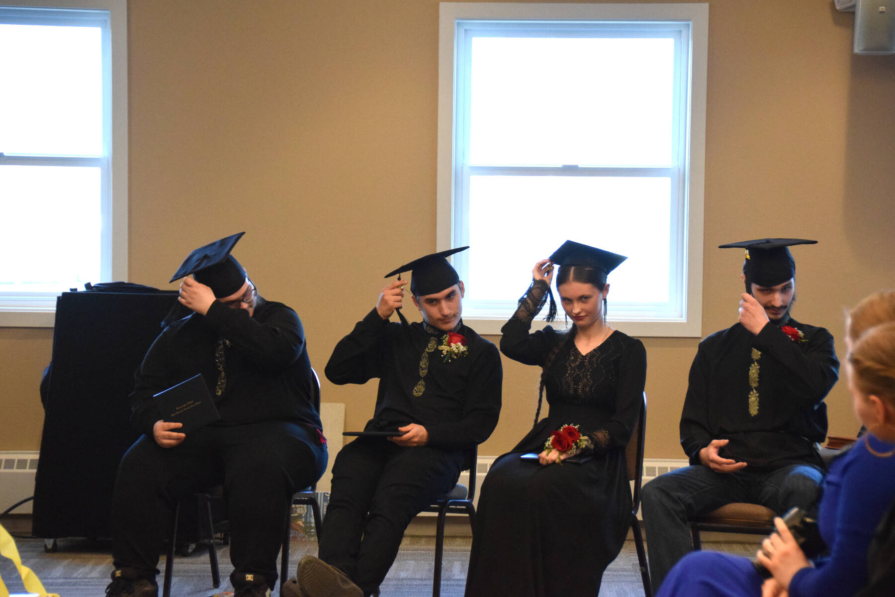 The Voznesenka School graduating class of 2025 moves their tassels following the presentation of their diplomas during the commencement ceremony held Monday, May 19, 2025, at Land’s End Resort in Homer, Alaska. (Delcenia Cosman/Homer News)