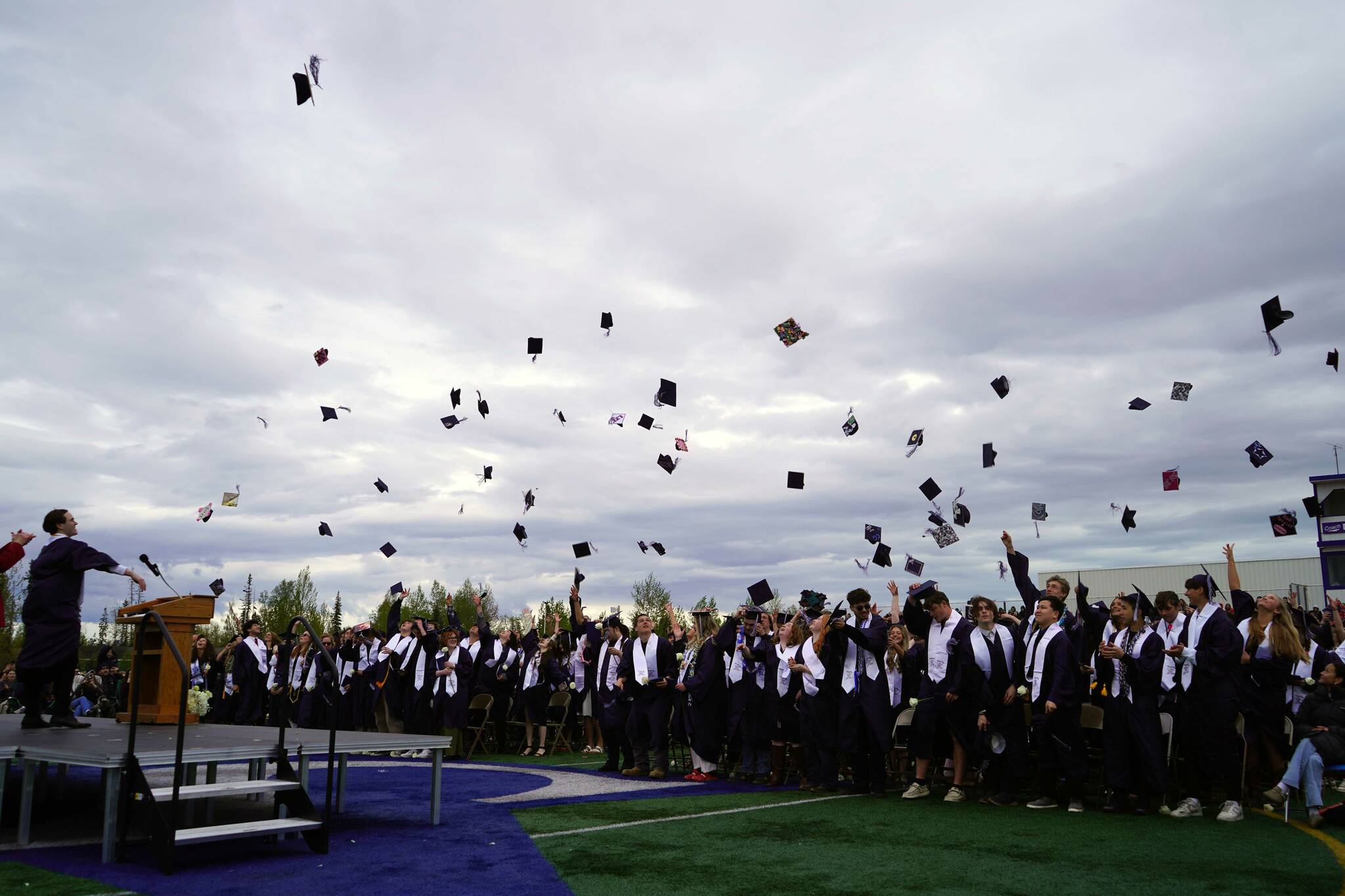 Graduates of Soldotna High School celebrate after receiving their diplomas on the school’s football field in Soldotna, Alaska, on Wednesday, May 21, 2025. (Jake Dye/Peninsula Clarion)