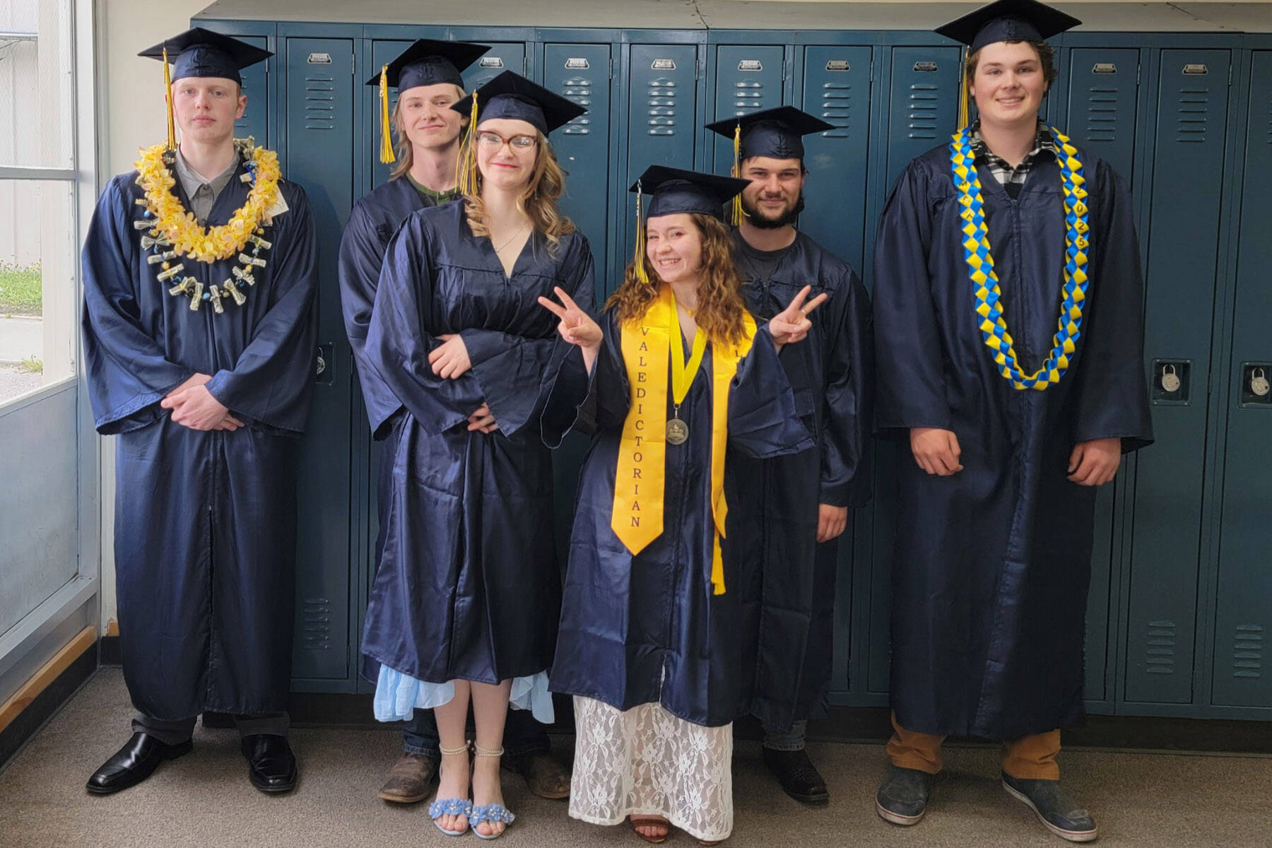 (from left to right) Ira Iwerks, Marcus Hunt, Isabell Hooton, Grace Kaiser, Michael Nalewako and Max Russell graduated from Ninilchik School on Tuesday, May 20, 2025, in Ninilchik, Alaska. Photo courtesy of Mattea Williamson