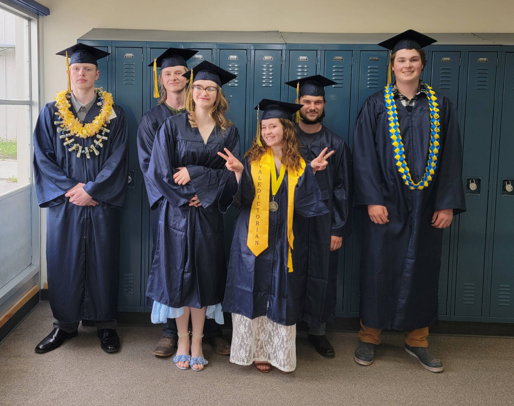 (from left to right) Ira Iwerks, Marcus Hunt, Isabell Hooton, Grace Kaiser, Michael Nalewako and Max Russell graduated from Ninilchik School on Tuesday, May 20, 2025, in Ninilchik, Alaska. Photo courtesy of Mattea Williamson