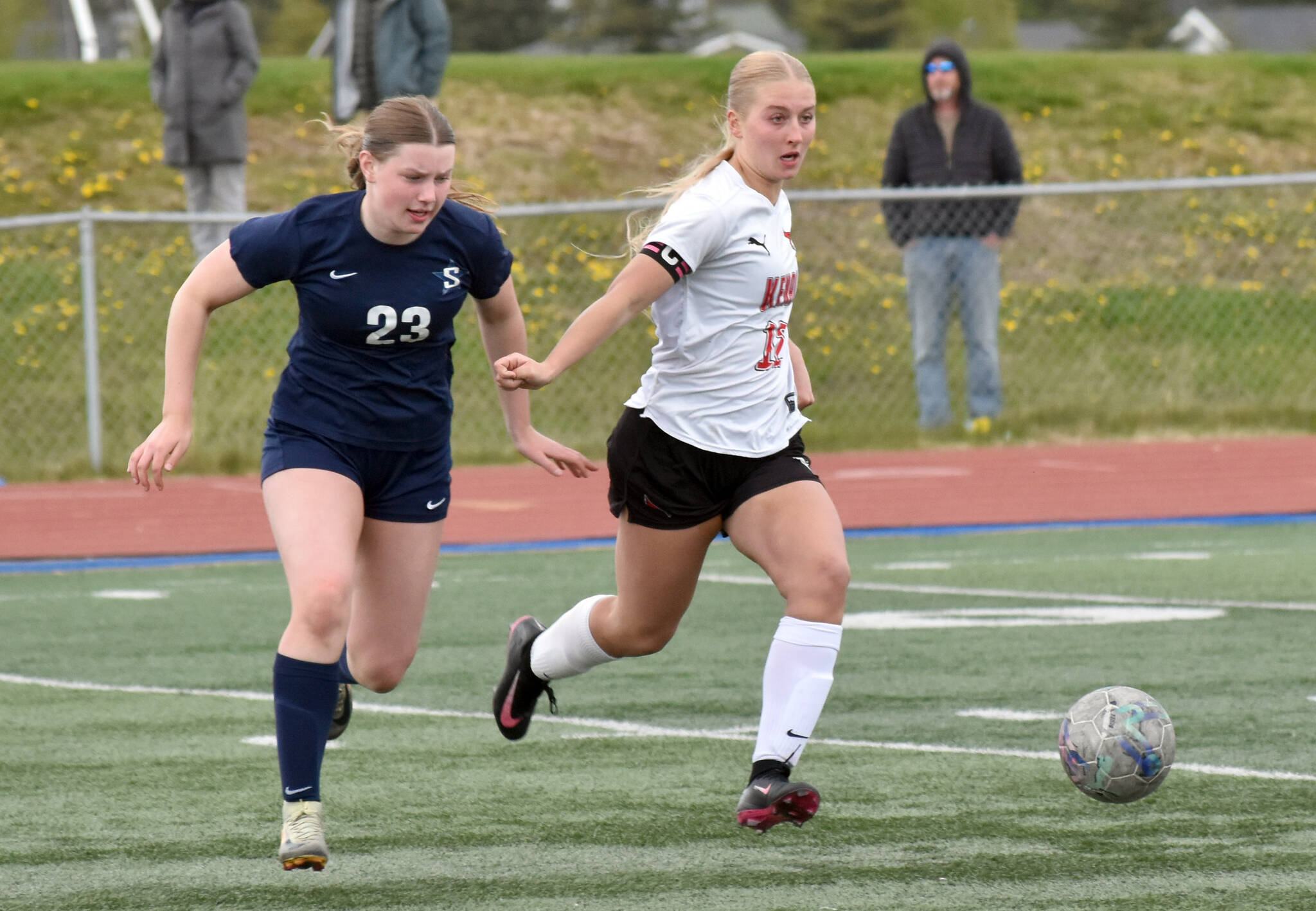 Soldotnas Jillian Duncan and Kenai Centrals Kate Wisnewski battle for the ball Thursday, May 22, 2025, at Justin Maile Field at Soldotna High School in Soldotna, Alaska. (Photo by Jeff Helminiak/Peninsula Clarion)