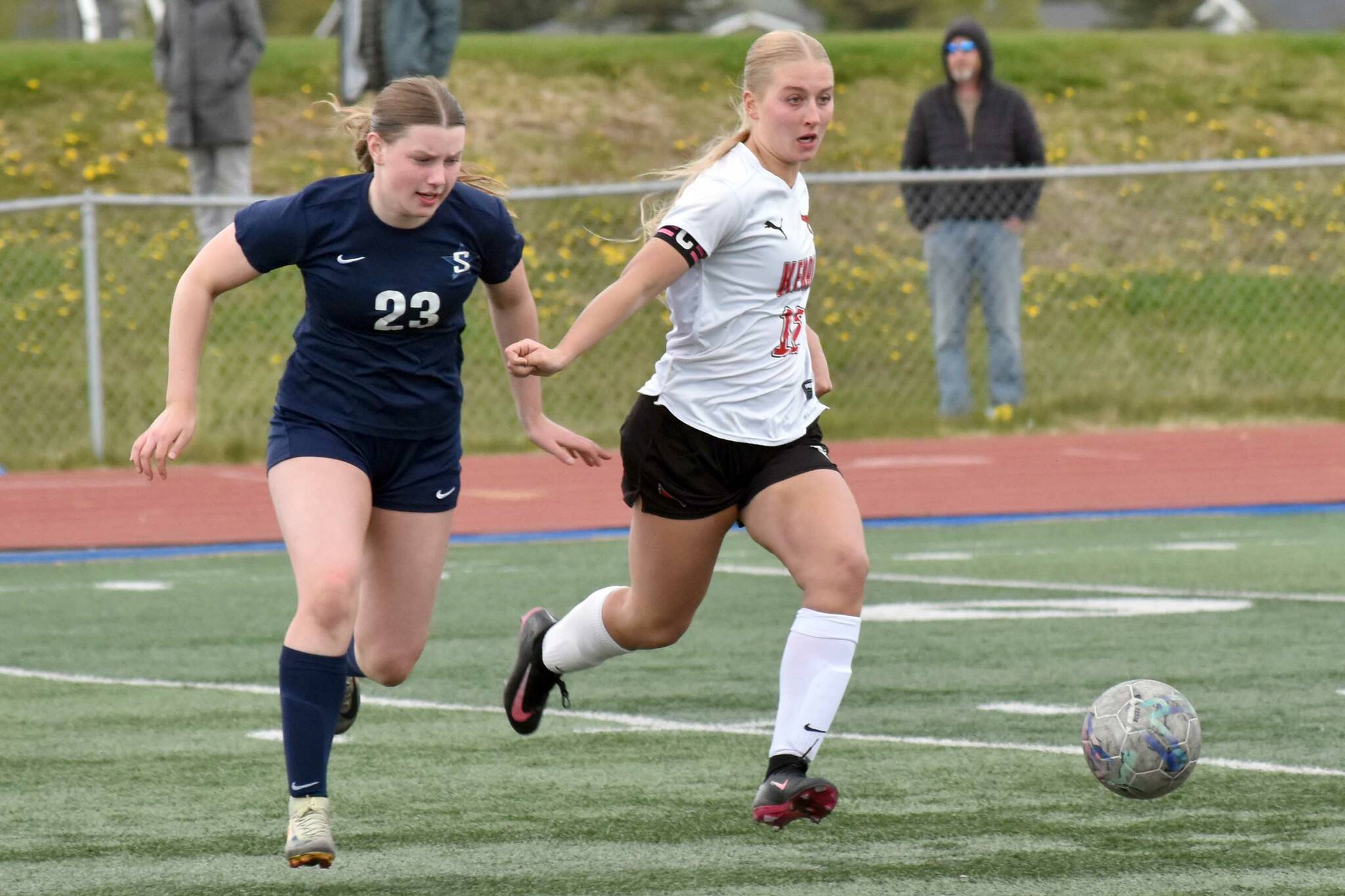 Soldotna's Jillian Duncan and Kenai Central's Kate Wisnewski battle for the ball Thursday, May 22, 2025, at Justin Maile Field at Soldotna High School in Soldotna, Alaska. (Photo by Jeff Helminiak/Peninsula Clarion)
