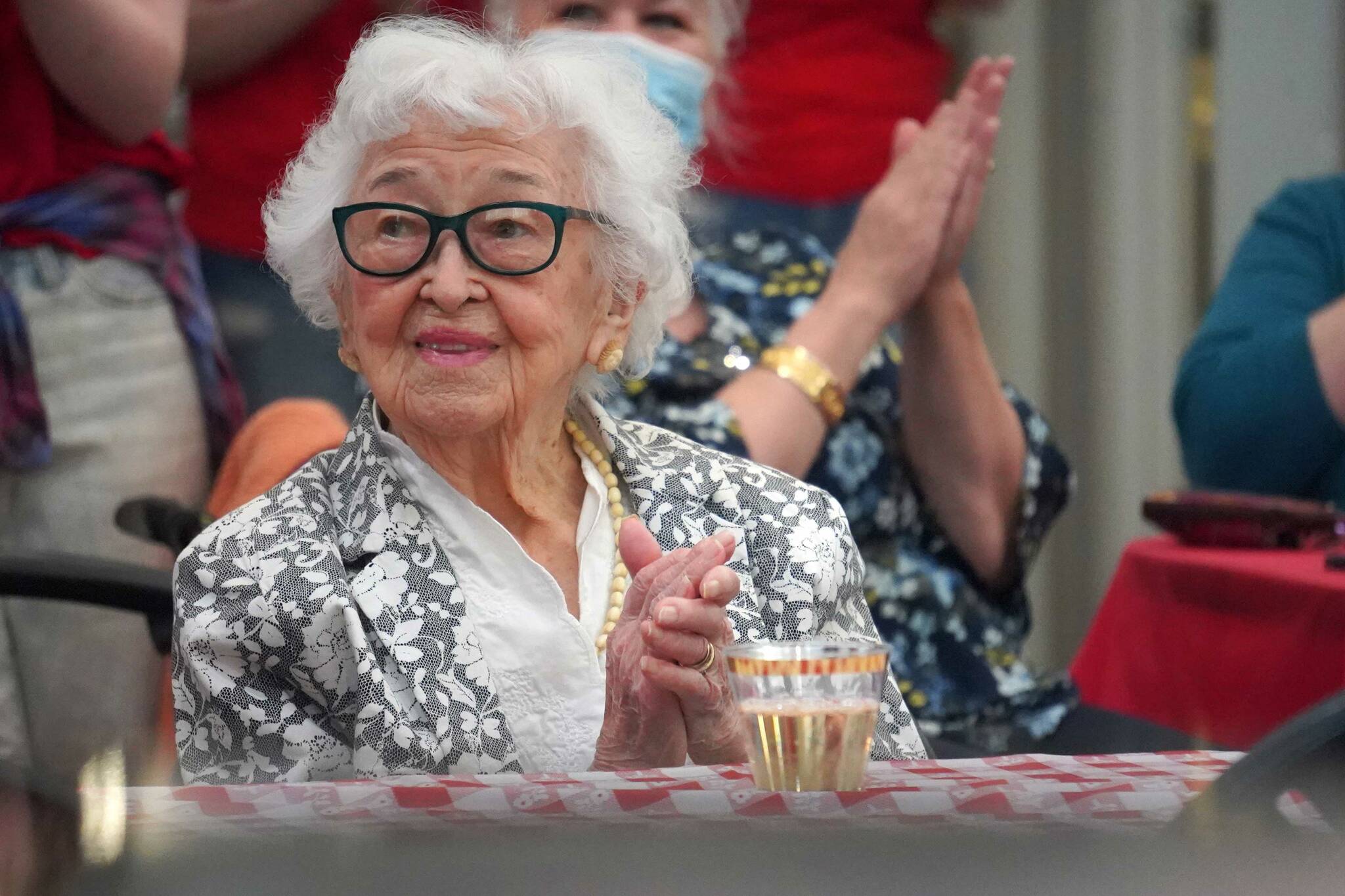 Hanna Stormo applauds during her 102nd birthday party at Aspen Creek Senior Living in Soldotna, Alaska, on Friday, May 30, 2025. (Jake Dye/Peninsula Clarion)