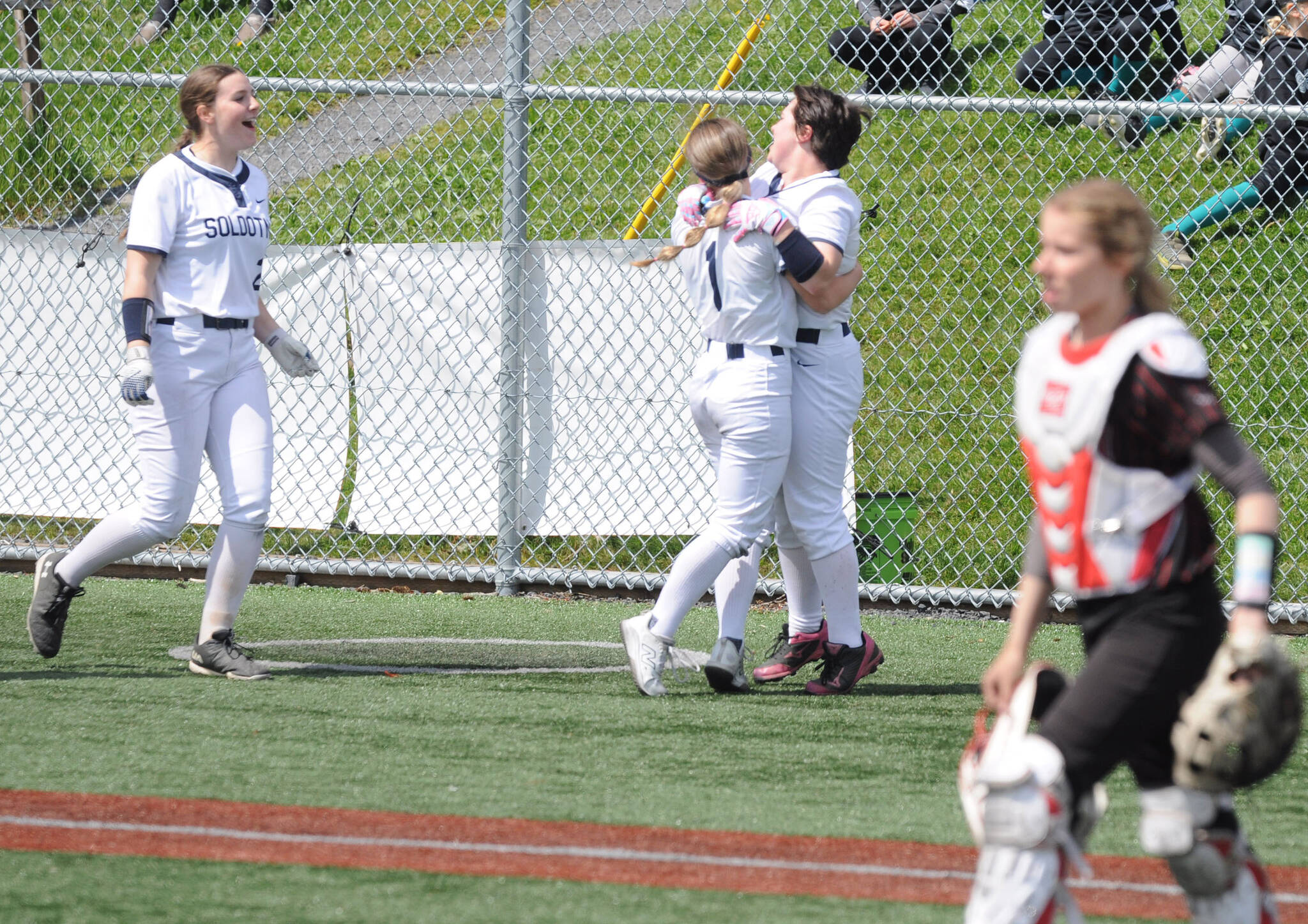 Soldotna players celebrate a walk-off 10-9 win over Kenai in the final of the playback bracket at the Northern Lights Conference softball tournament Saturday, May 31, 2025, at Baranof Field in Kodiak, Alaska. (Photo by Derek Clarkston/Kodiak Daily Mirror)