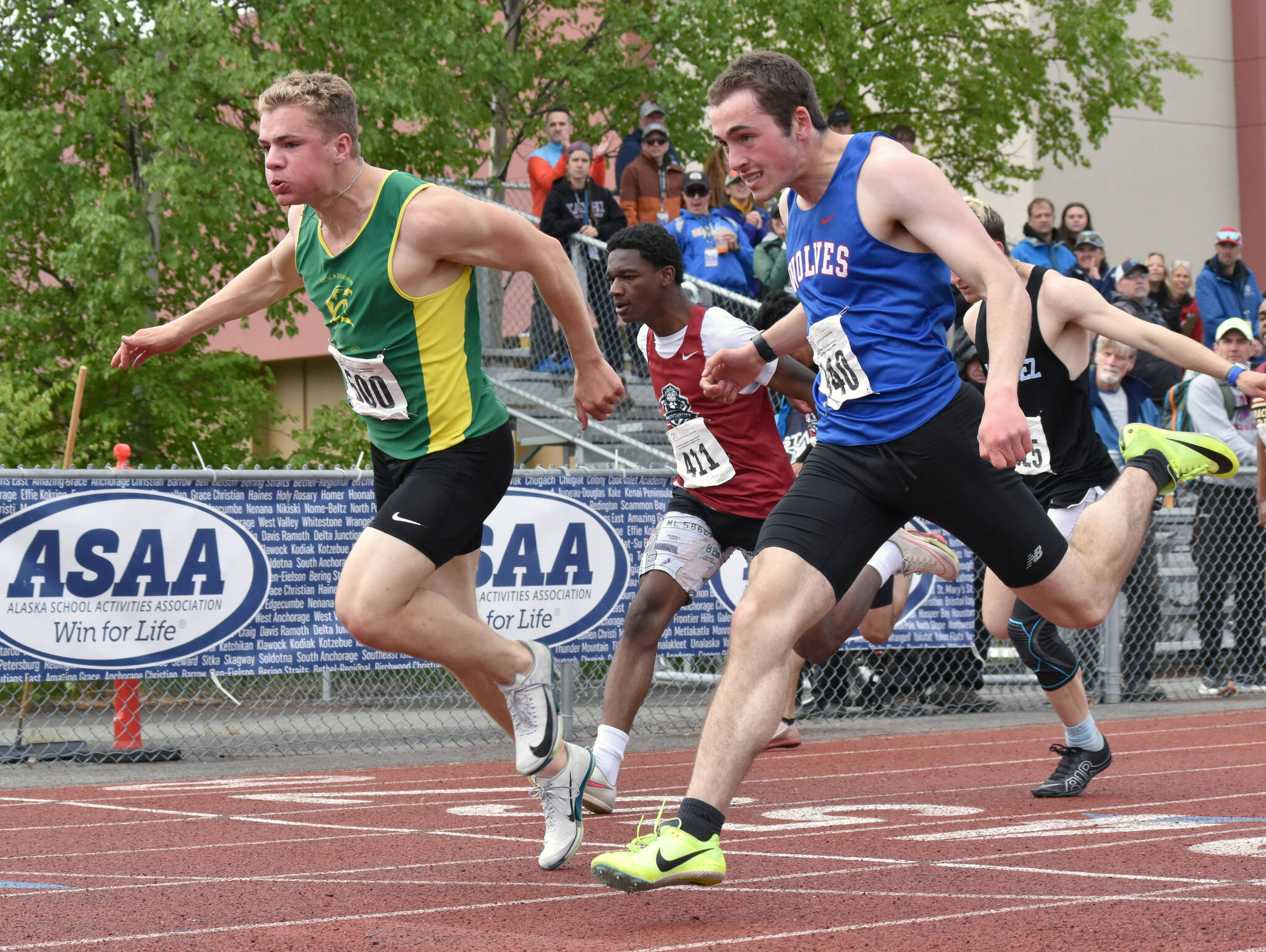 Seward’s Ronan Bickling nips Sitka’s Calder Prussian for the 100-meter dash title Saturday, May 31, 2025, at the Division II state track meet at Dimond High School in Anchorage, Alaska. (Photo by Jeff Helminiak/Peninsula Clarion)