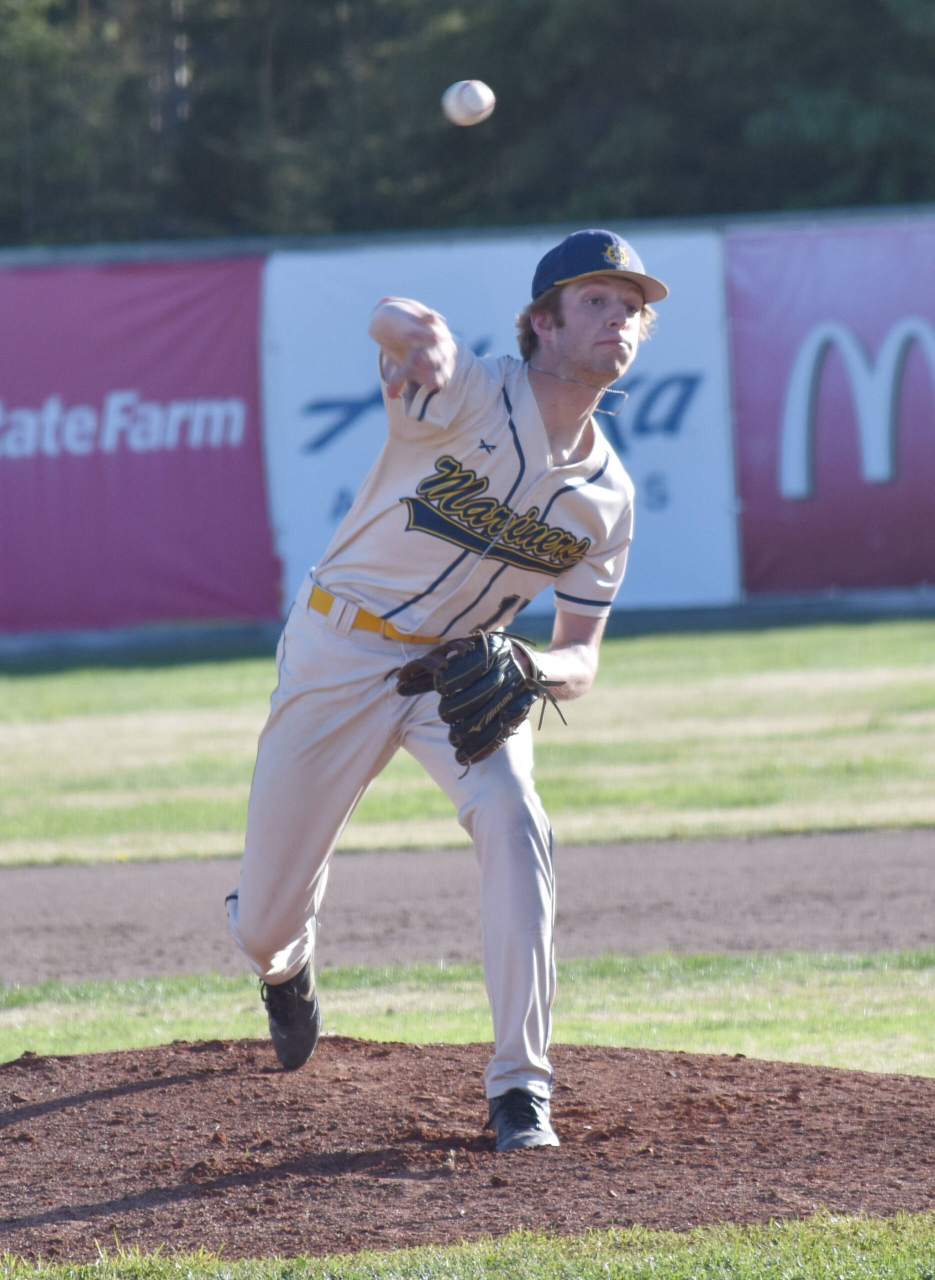 Homer’s CJ Burns delivers to Kenai Central at the Division II state baseball tournament Thursday, June 6, 2025, at Coral Seymour Memorial Park in Kenai, Alaska. (Photo by Jeff Helminiak/Peninsula Clarion)