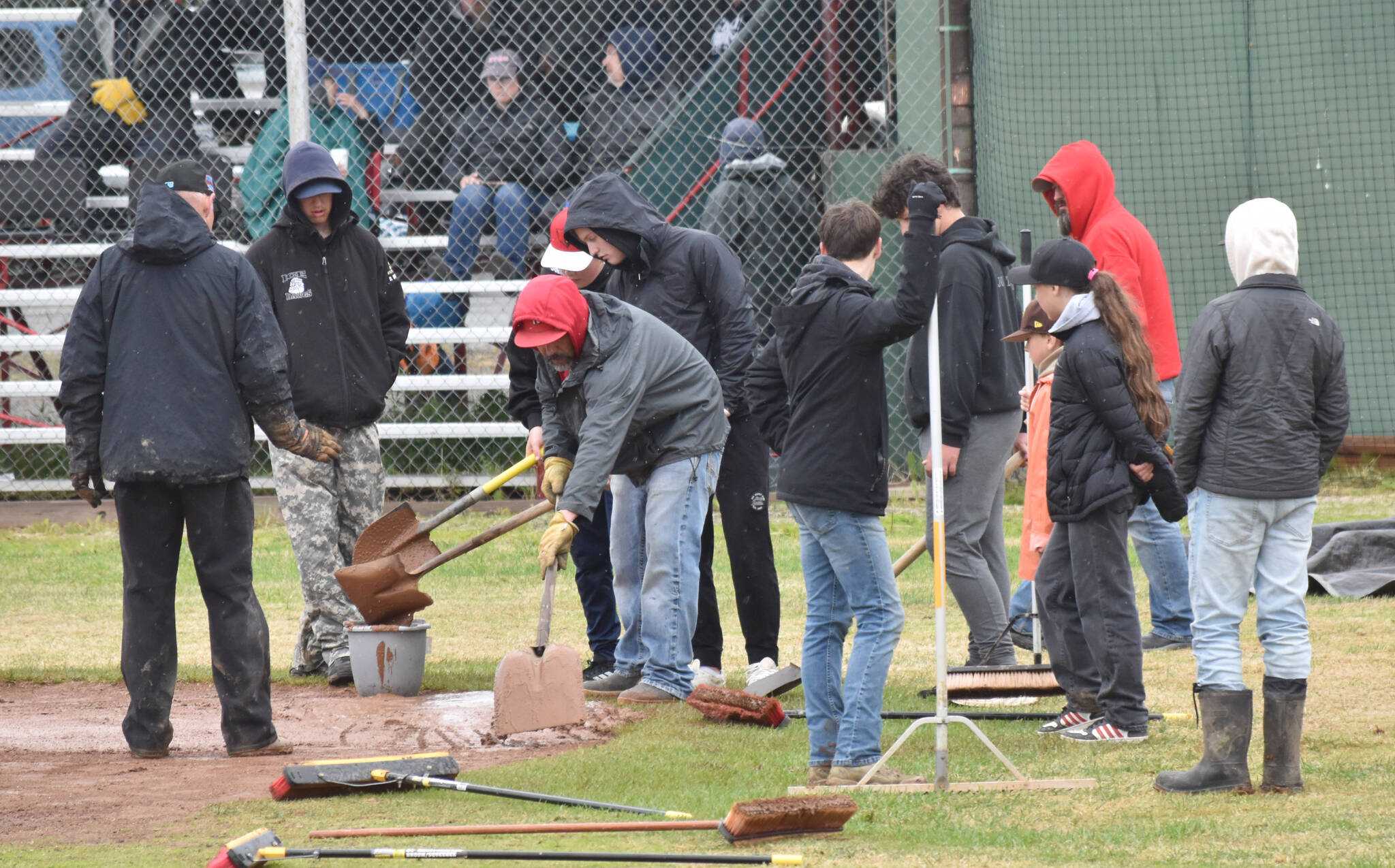 The grounds crew prepares the field at the Division II state baseball tournament at Coral Seymour Memorial Park in Kenai, Alaska, on Saturday, June 7, 2025. (Photo by Jeff Helminiak/Peninsula Clarion)