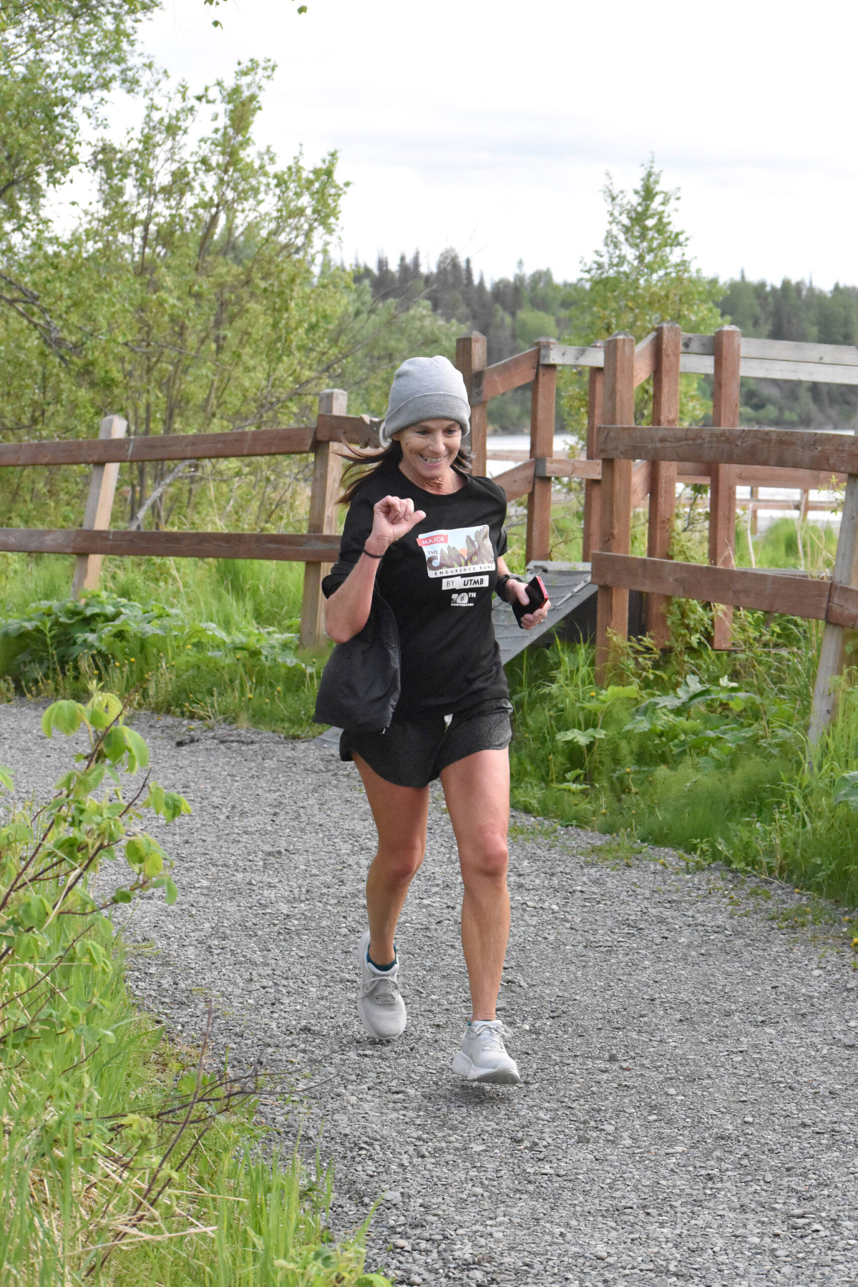 Carolyn Cunha of Bozeman, Montana, runs along the Kenai River at the Tsalteshi Backyard Ultra on Friday, June 6, 2025, in Soldotna, Alaska. (Photo by Jeff Helminiak/Peninsula Clarion)