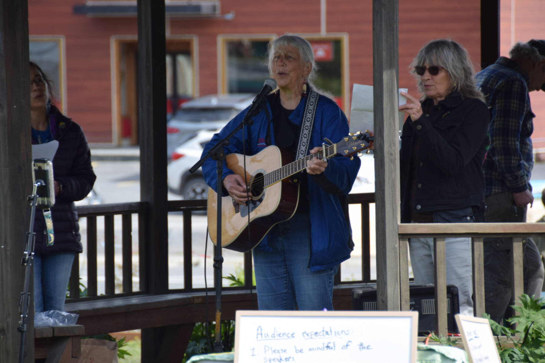 Cindy McKenna performs her song, “It’s My Flag Too,” on Friday, June 6, 2025, at WKFL Park in Homer, Alaska. (Chloe Pleznac/Homer News)