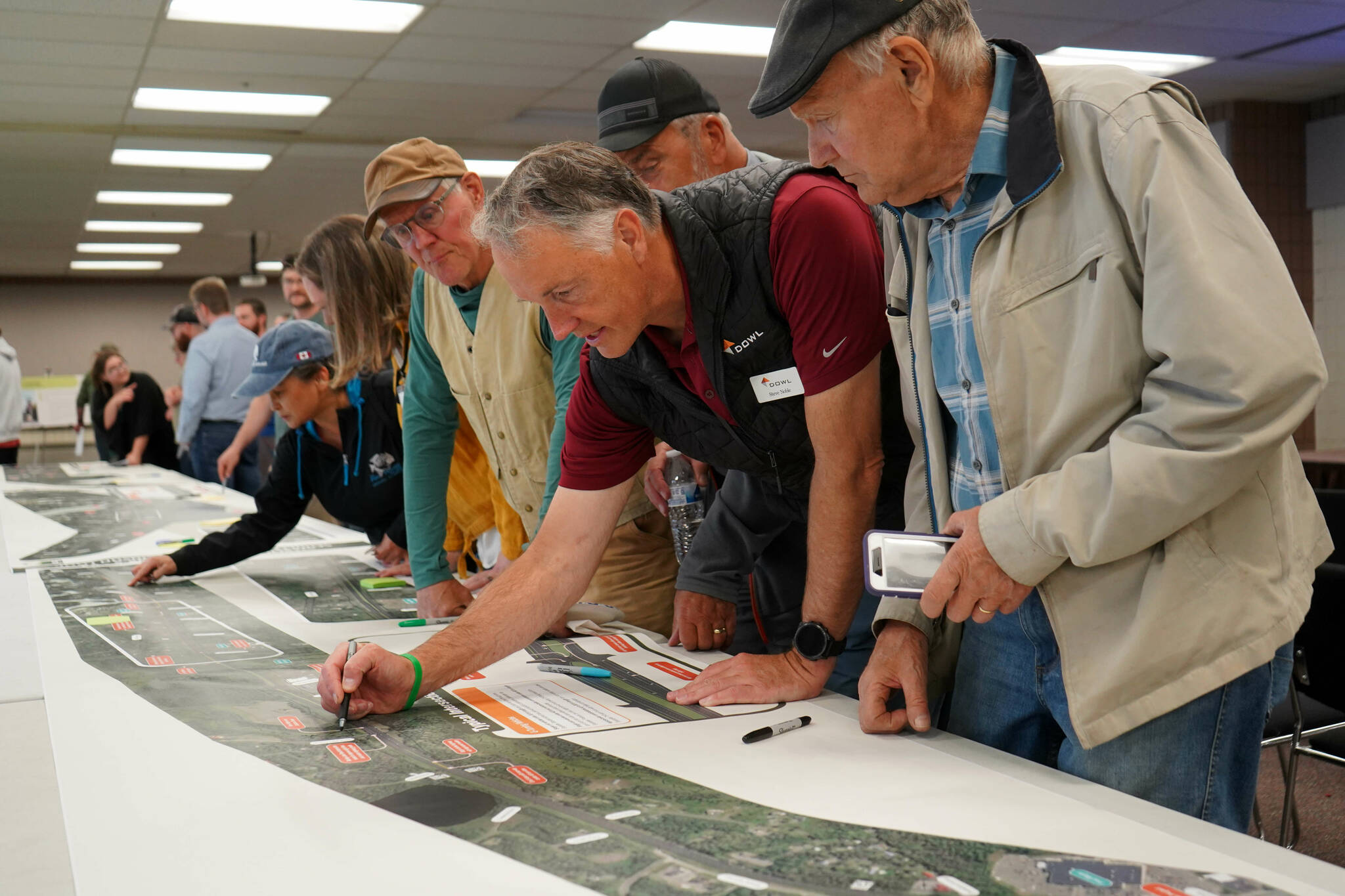 Leads for the Sterling Safety Corridor Improvements Project field questions and showcase their “preferred design” during an open house meeting at the Soldotna Regional Sports Complex in Soldotna, Alaska, on Tuesday, June 10, 2025. (Jake Dye/Peninsula Clarion)