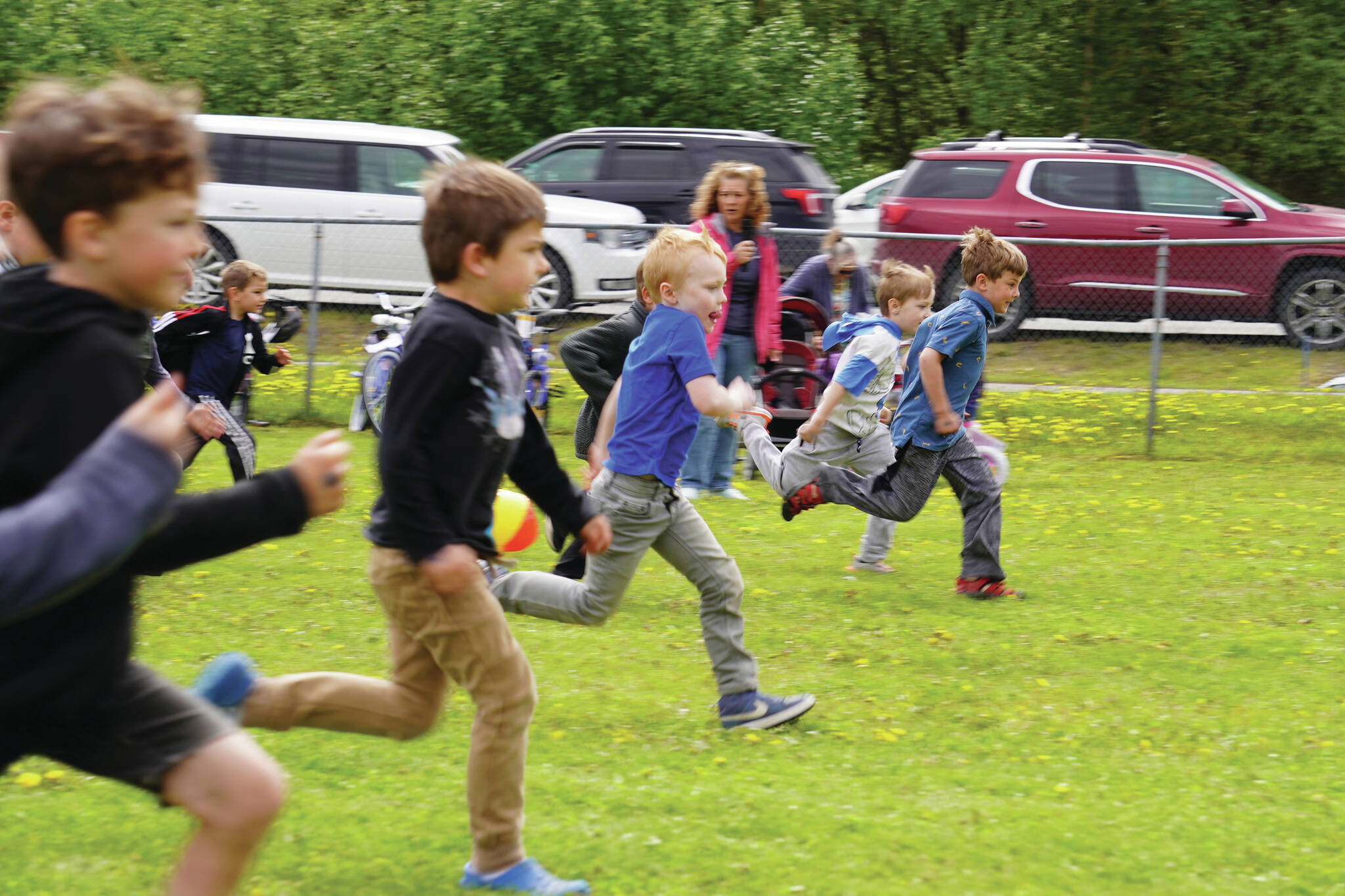 Kids take off running as they participate in field games during Family Fun in the Midnight Sun on Saturday, June 17, 2023, at the Nikiski Community Recreation Center in Nikiski, Alaska. (Jake Dye/Peninsula Clarion)