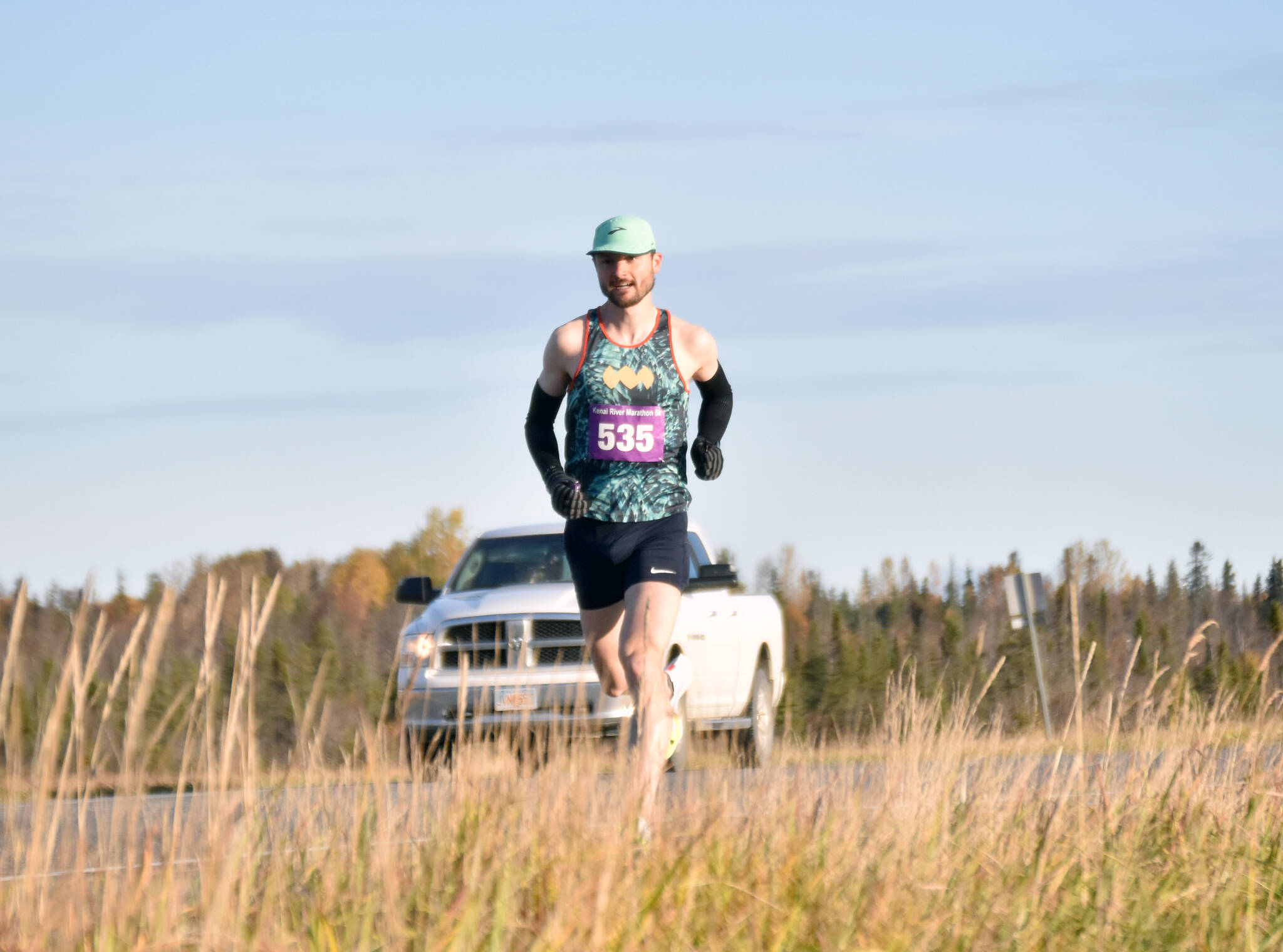 Kenai’s Jason Parks runs to a win in the men’s marathon at the Kenai River Marathon on Sunday, Sept. 29, 2024, in Kenai, Alaska. (Photo by Jeff Helminiak/Peninsula Clarion)