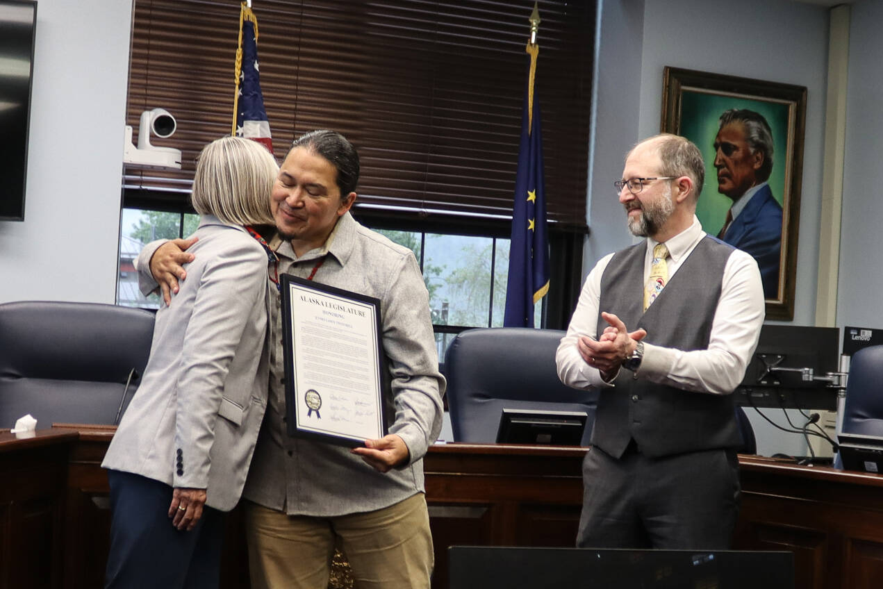 X̱’unei Lance Twitchell receives his legislative citation from Rep. Andi Story, D Juneau, at a ceremony at the Alaska State Capitol on Saturday. (Ellie Ruel / Juneau Empire)