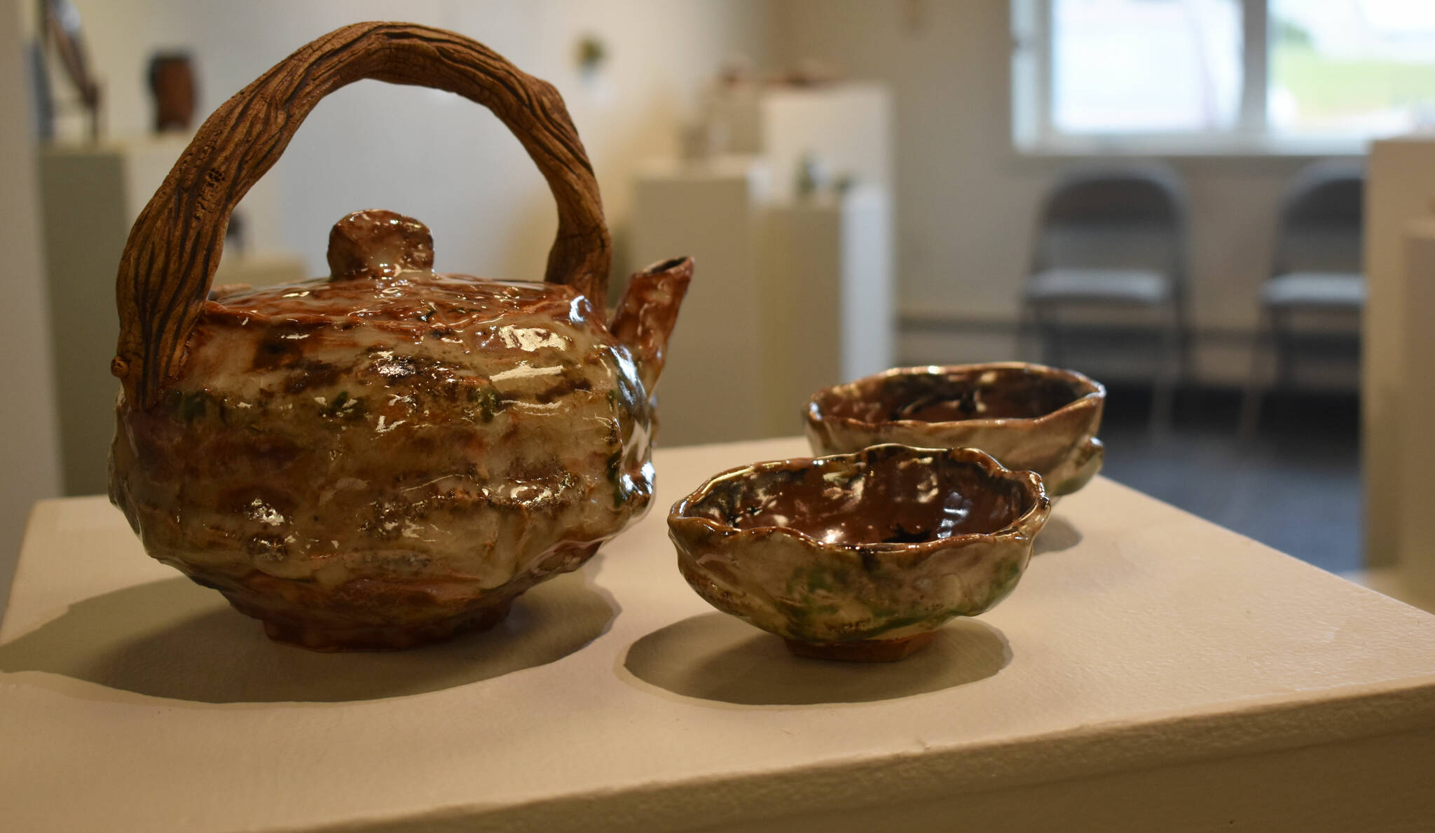 A clay tea set on display at the Kenai Potters Guild exhibit, “River,” hosted by the Kenai Art Center. (Jonas Oyoumick/Peninsula Clarion)