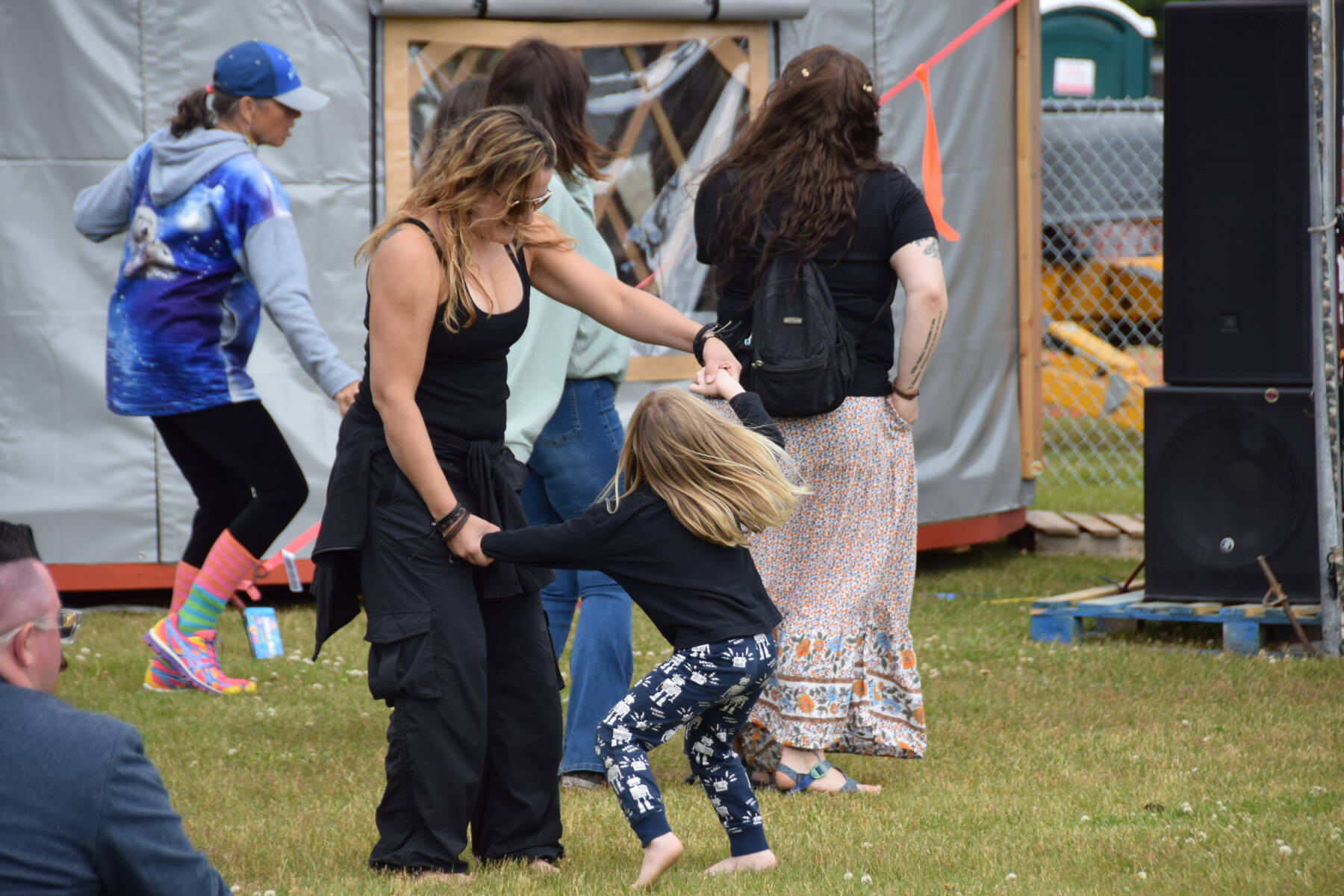 Concert-goers dance to music by The Discopians at KBBI’s Concert on the Lawn on Saturday, July 12, 2025, at Karen Hornaday Park in Homer, Alaska. (Delcenia Cosman/Homer News)