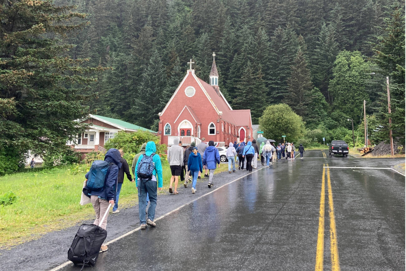 Evacuees in Seward, Alaska, walk along Adams Street following a tsunami warning on Wednesday, July 16, 2025. (Photo by Jeff Helminiak/Peninsula Clarion)