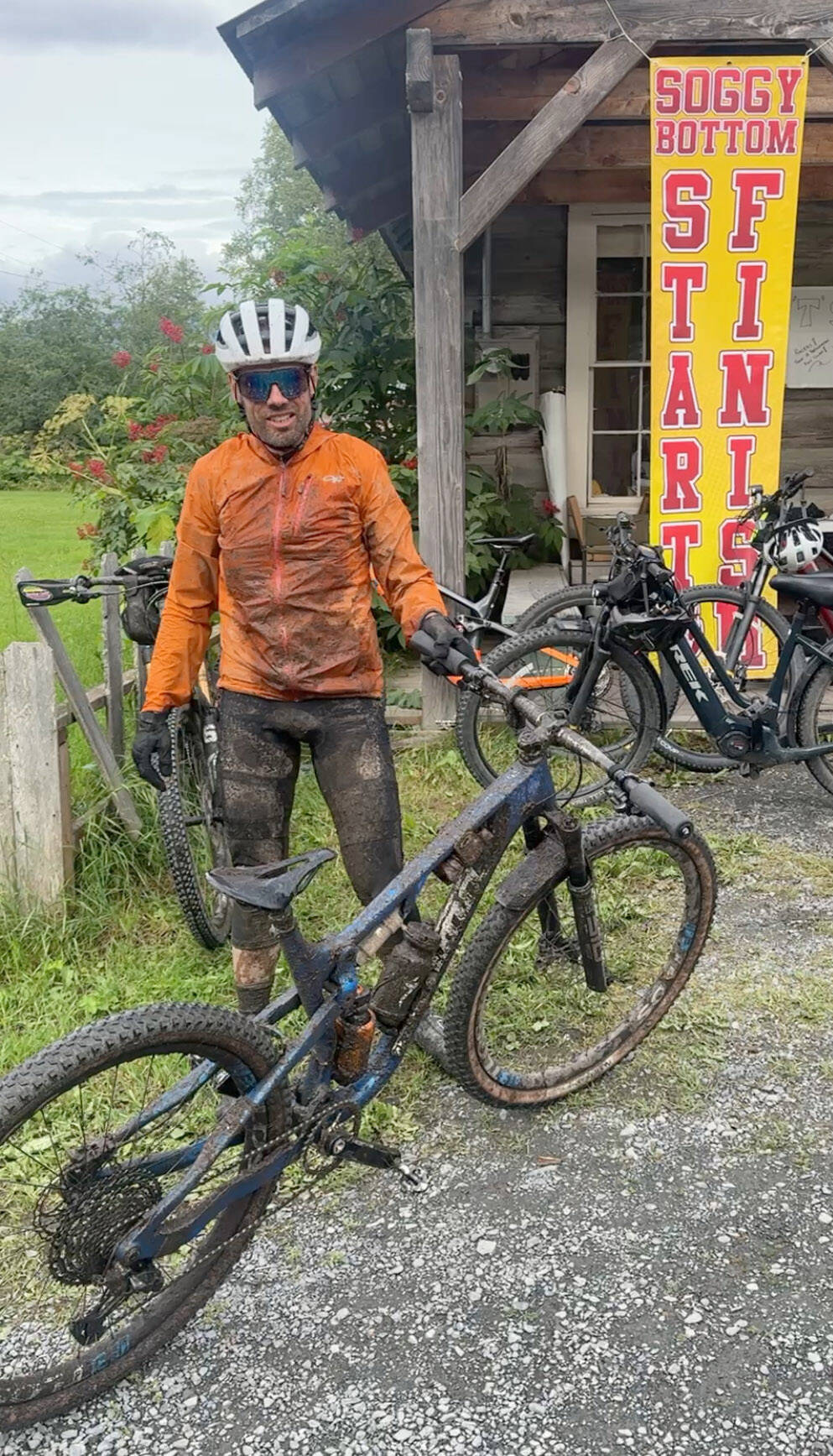 Sewards Chaz DiMarzio dismounts his bike after winning the Soggy Bottom 100 on Saturday, Aug. 2, 2025, in Hope, Alaska. (Photo provided)