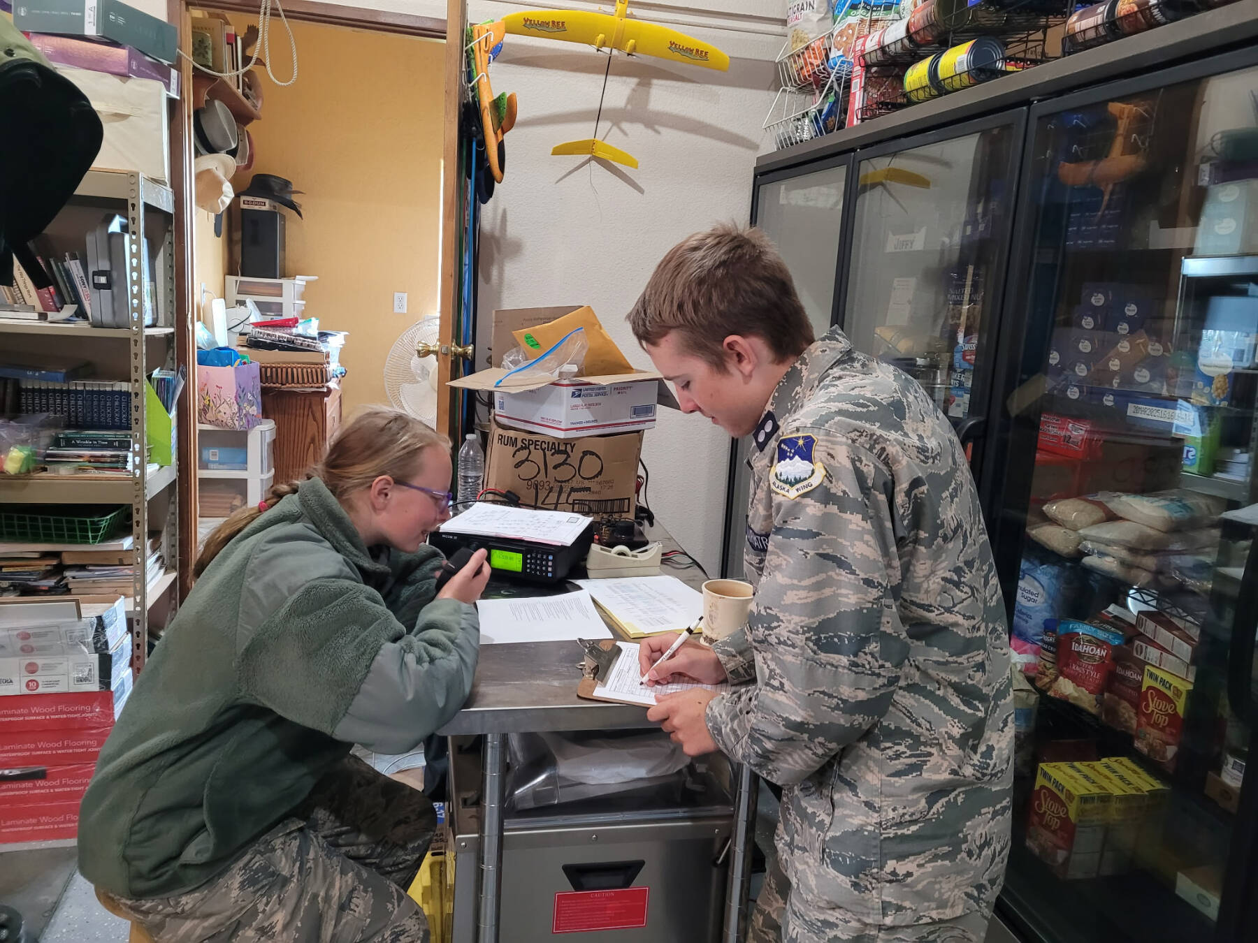 Civil Air Patrol Cadet 1st Lt. Hugh Traugott (right) works with Cadet Airman First Class Audrey Crocker (left) during a statewide training exercise on disaster response on Aug. 9-10, 2025, in Homer, Alaska. (Photo courtesy of Laurie Gentle)