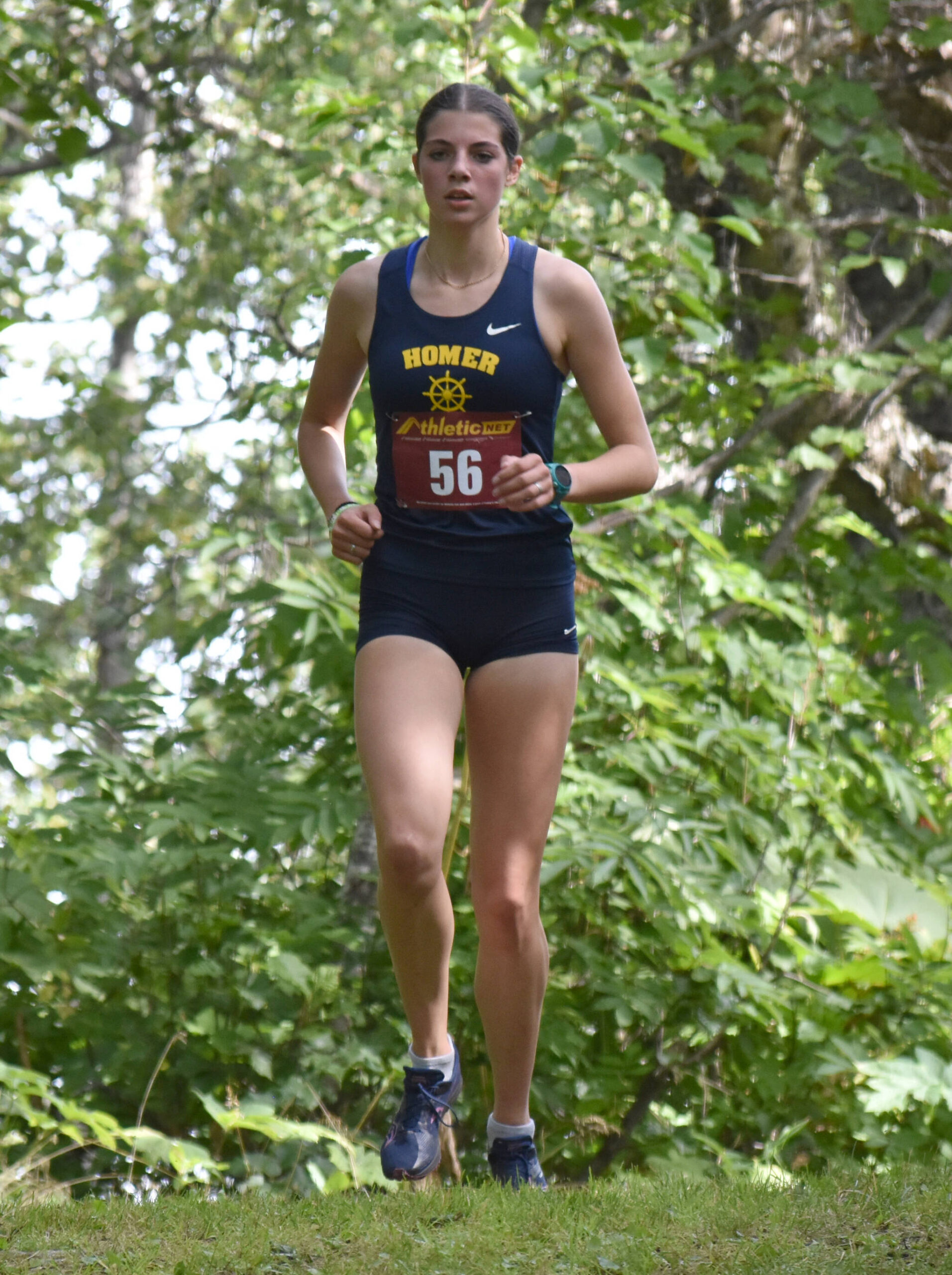 Homers Etta Bynagle runs to second place in the freshmen-sophomore girls race at the Kenai/Nikiski Class Races on Monday, Aug. 18, 2025, at Nikiski Middle-High School in Nikiski, Alaska. (Photo by Jeff Helminiak/Peninsula Clarion)