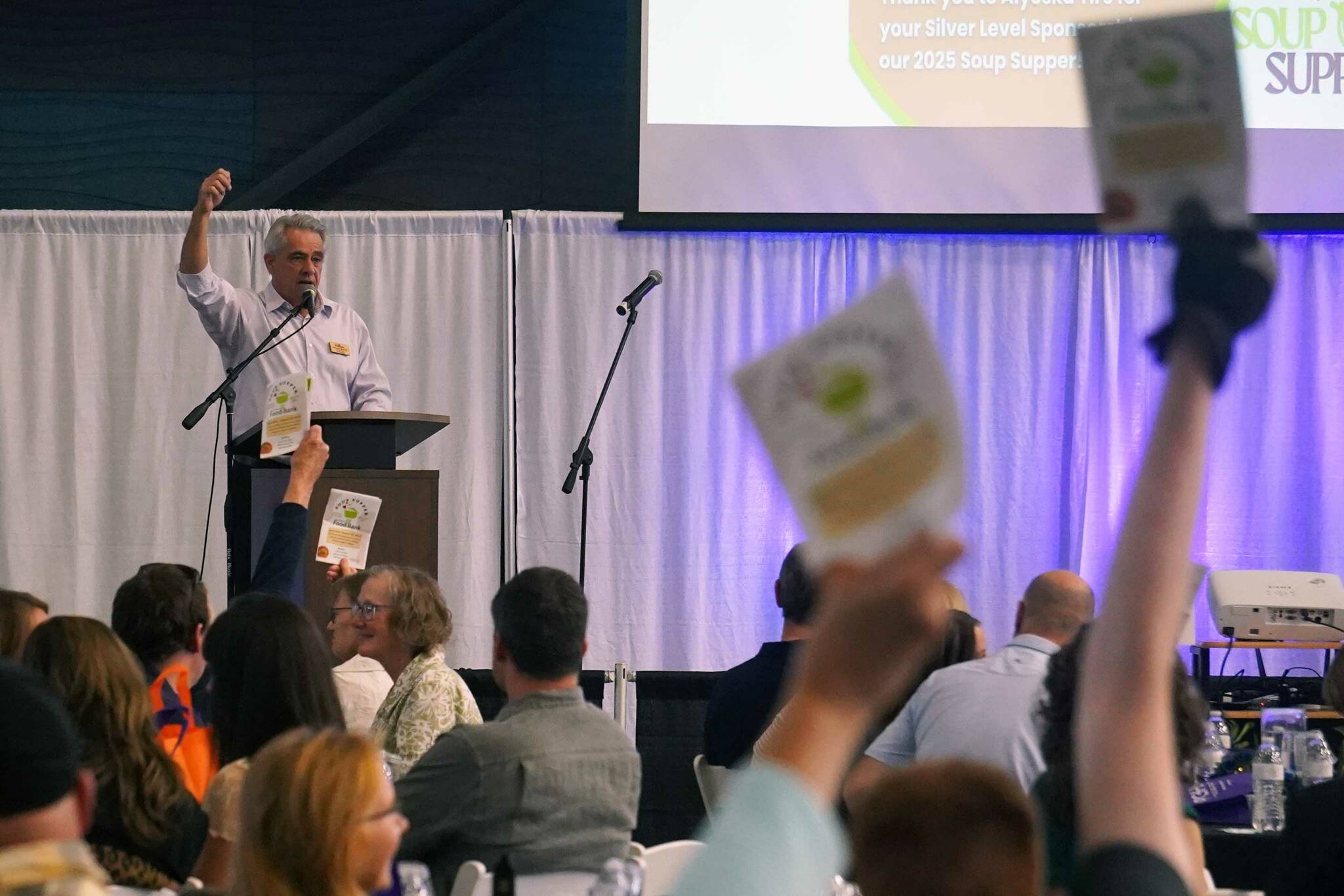 Kenai Peninsula Food Bank Board President Sean OReilly speaks at the start of the Kenai Peninsula Food Banks annual Soup Supper fundraiser at the Soldotna Field House in Soldotna, Alaska, on Saturday, Aug. 23, 2025. (Jake Dye/Peninsula Clarion)