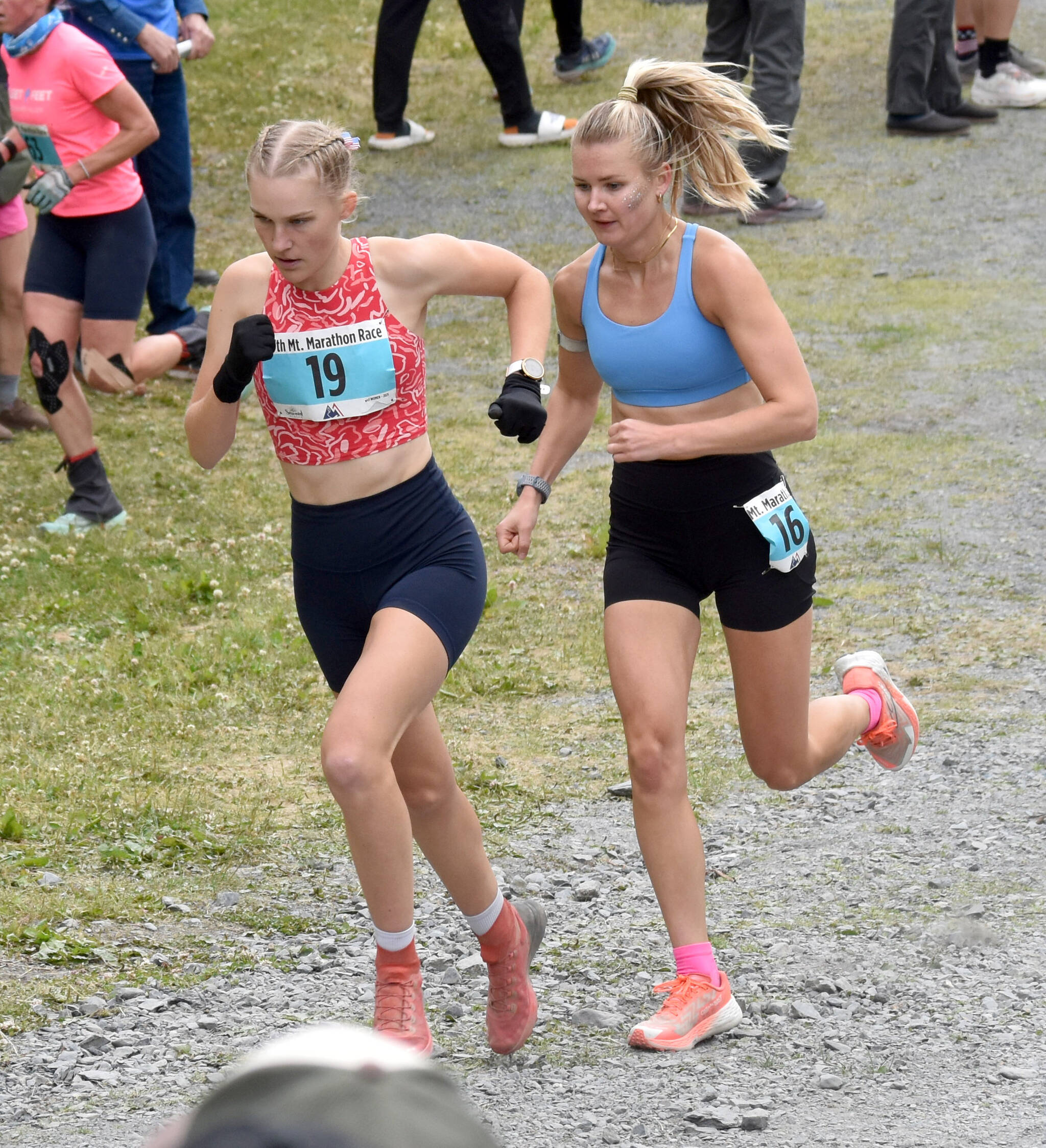 Nevadas Claire Nelson, 22, and Anchorages Taylor Deal, 31, approach the mountain during the womens race at the Mount Marathon Race on July 4, 2025, in Seward, Alaska. (Photo by Jeff Helminiak/Peninsula Clarion)