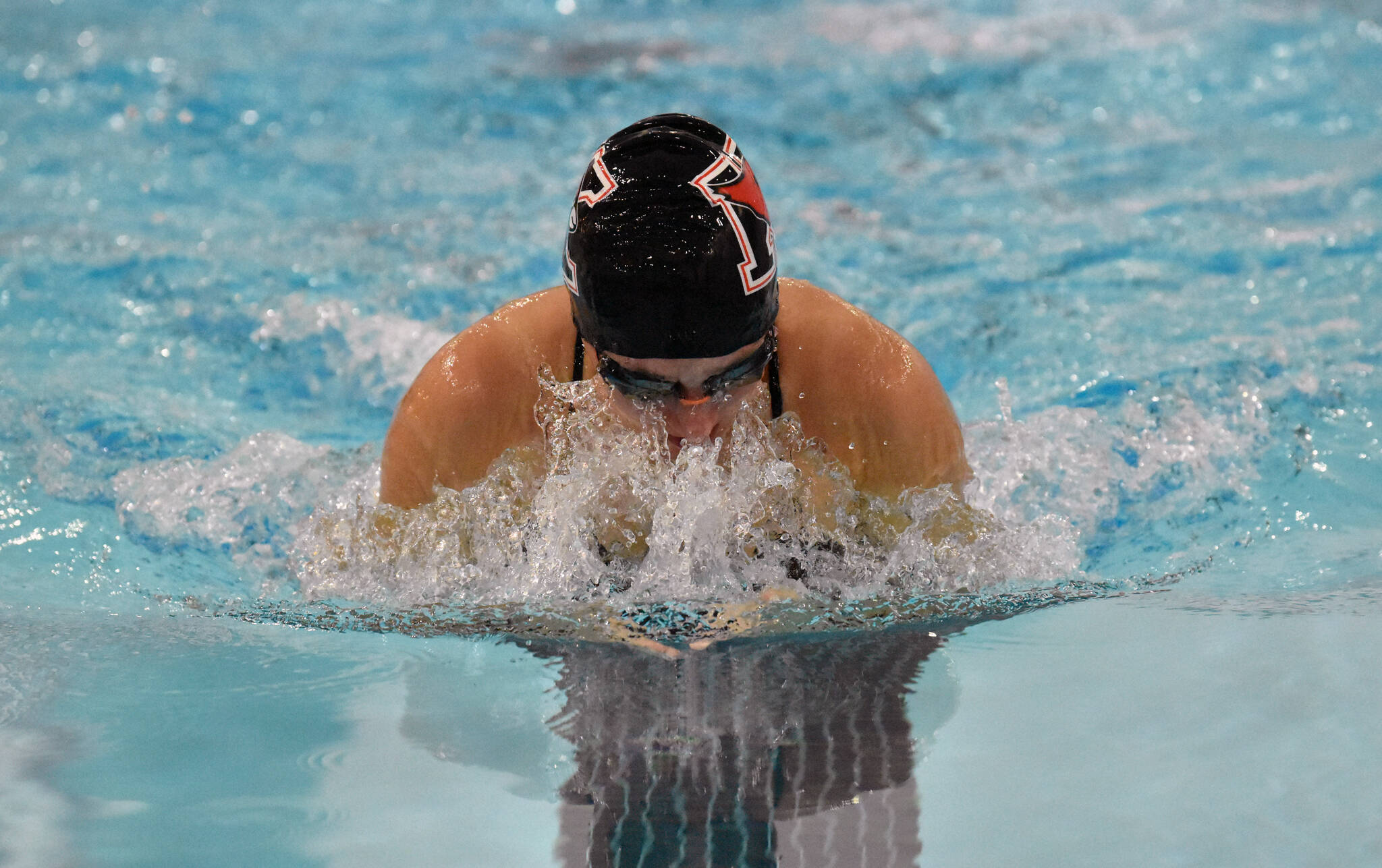 Kenai Centrals Isla Crouse competes in the 100-breaststroke Friday, Aug. 29, 2025, at Kenai Central High School in Kenai, Alaska. (Photo by Jeff Helminiak/Peninsula Clarion)