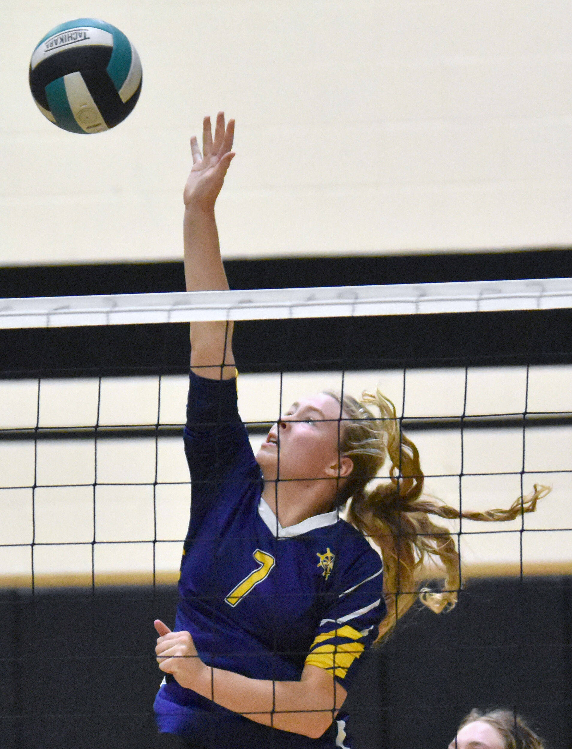 Homers Swift Blackstock attacks against Nikiski on Saturday, Sept. 6, 2025, at the 18th annual Shayna Pritchard Memorial Volleyball Tournament at Nikiski Middle-High School in Nikiski, Alaska. (Photo by Jeff Helminiak/Peninsula Clarion)
