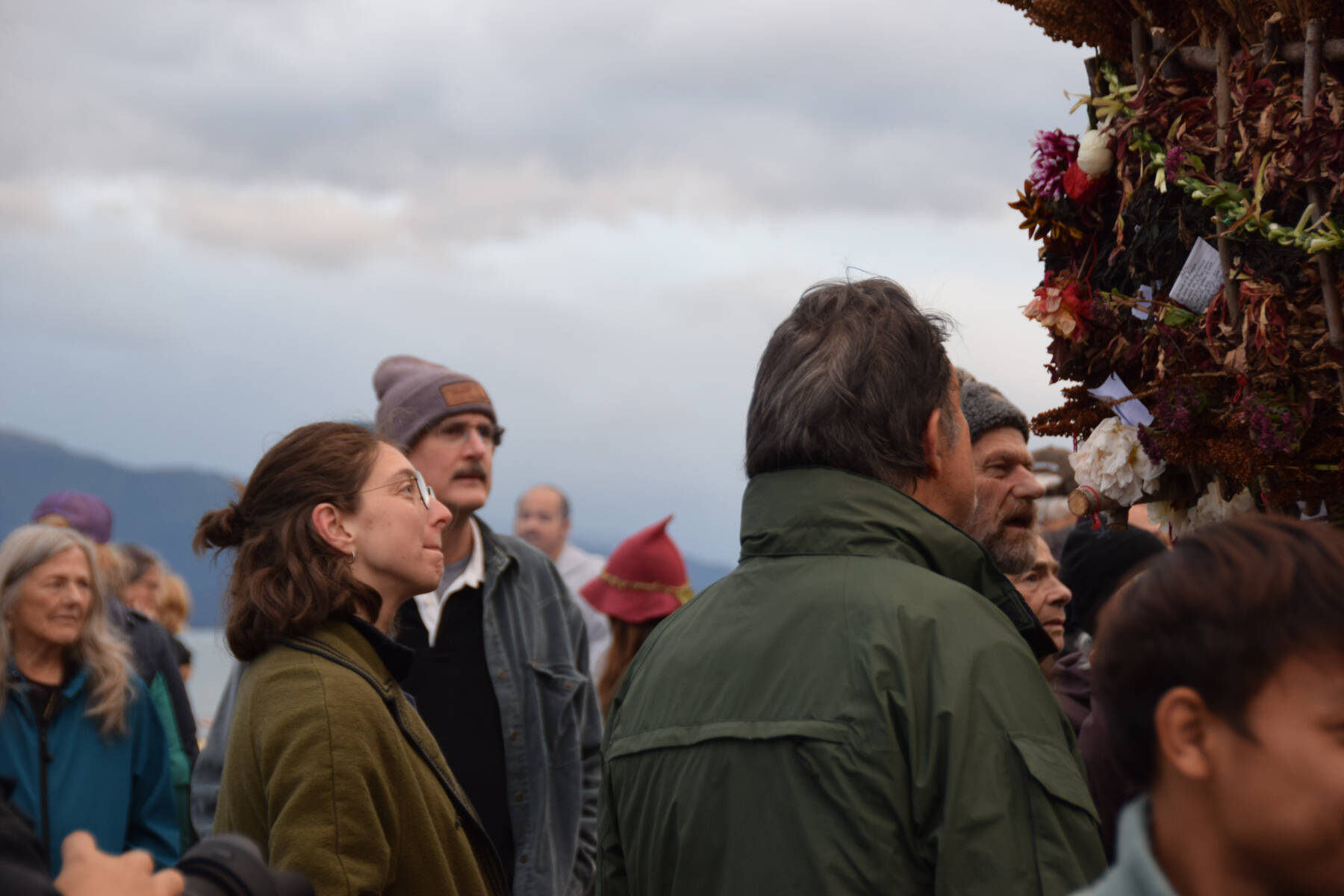 People admire the basket on Sunday, Sept. 7, 2025, at Mariner Park in Homer, Alaska. (Chloe Pleznac/Homer News)