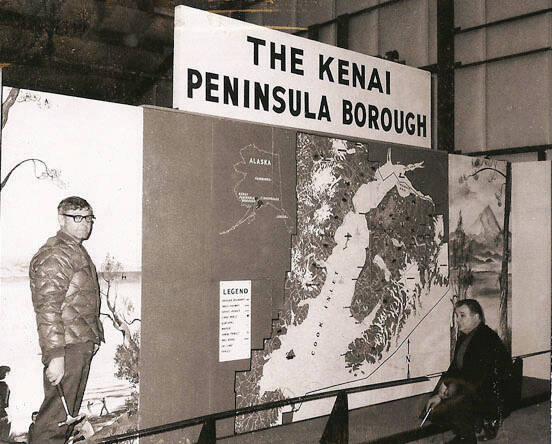 In this old Cheechako News photo, officials consider an early display map of the Kenai Peninsula Borough, 1969.