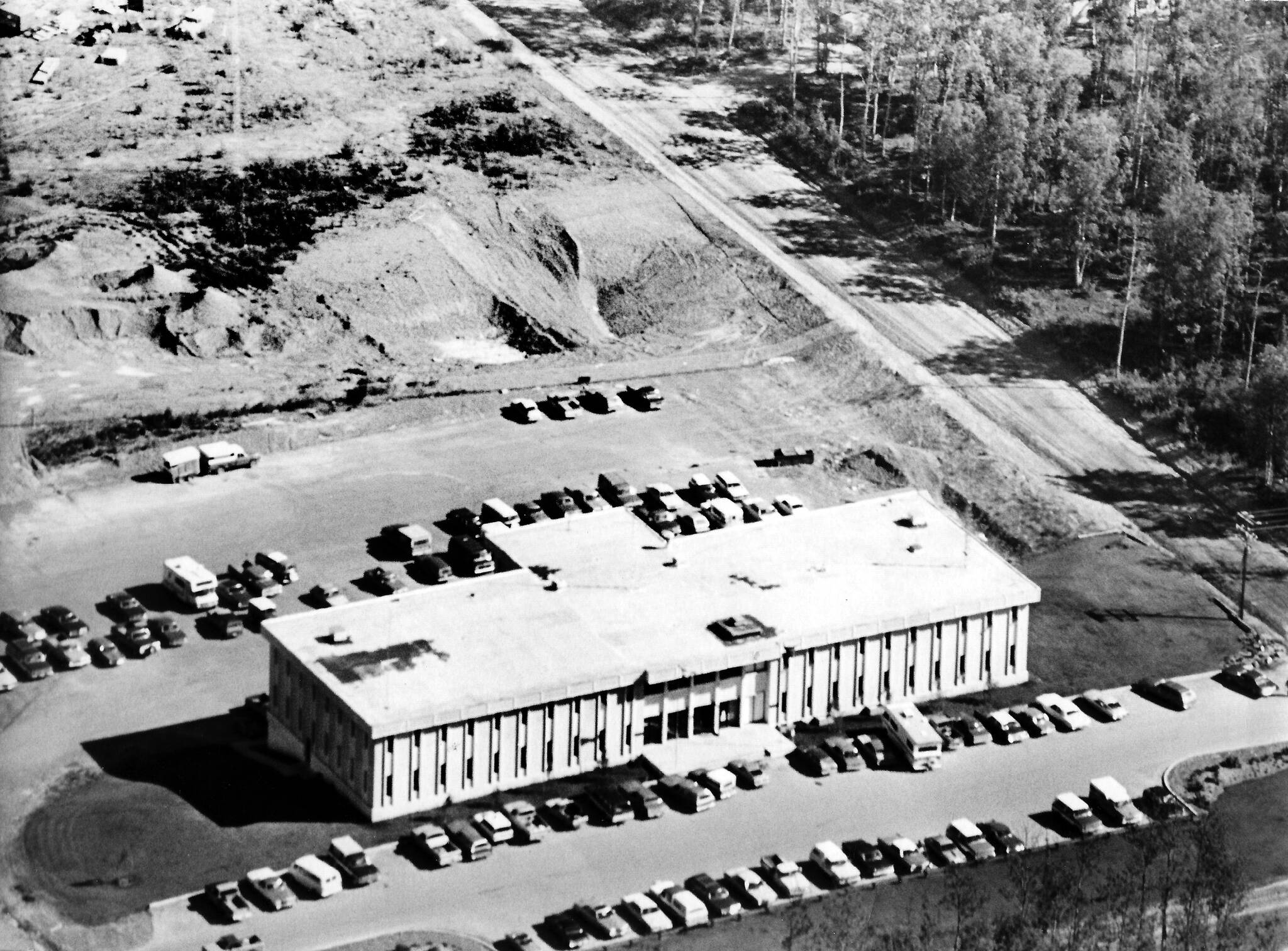 This aerial photo, courtesy of the Kenai Historical Society, shows the Kenai Peninsula Borough administration building in its early days, likely in the 1970s. The building was completed in 1971.