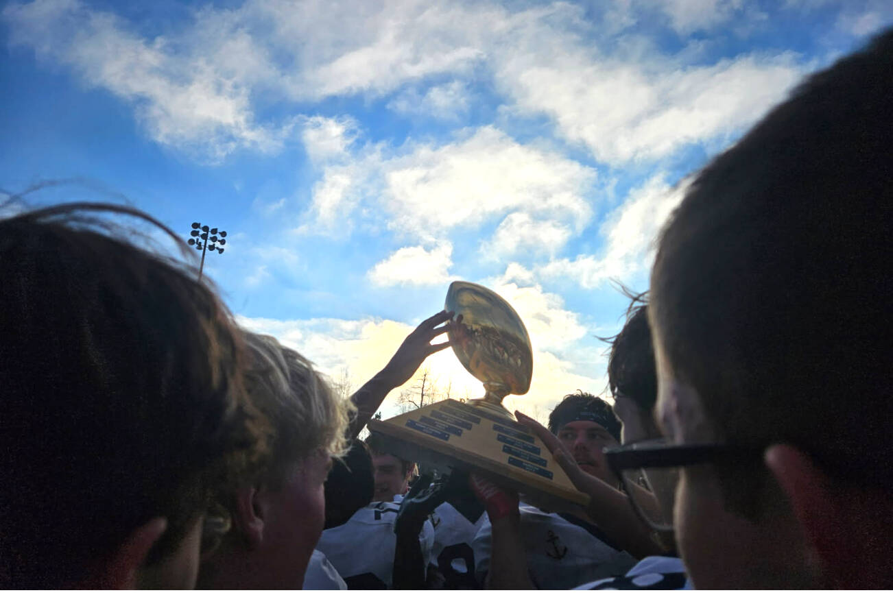 The Homer Mariners varsity football team celebrates their victory after the Division III state championships game on Saturday, Oct. 18, 2025, in Wasilla, Alaska. Photo provided by Justin Zank