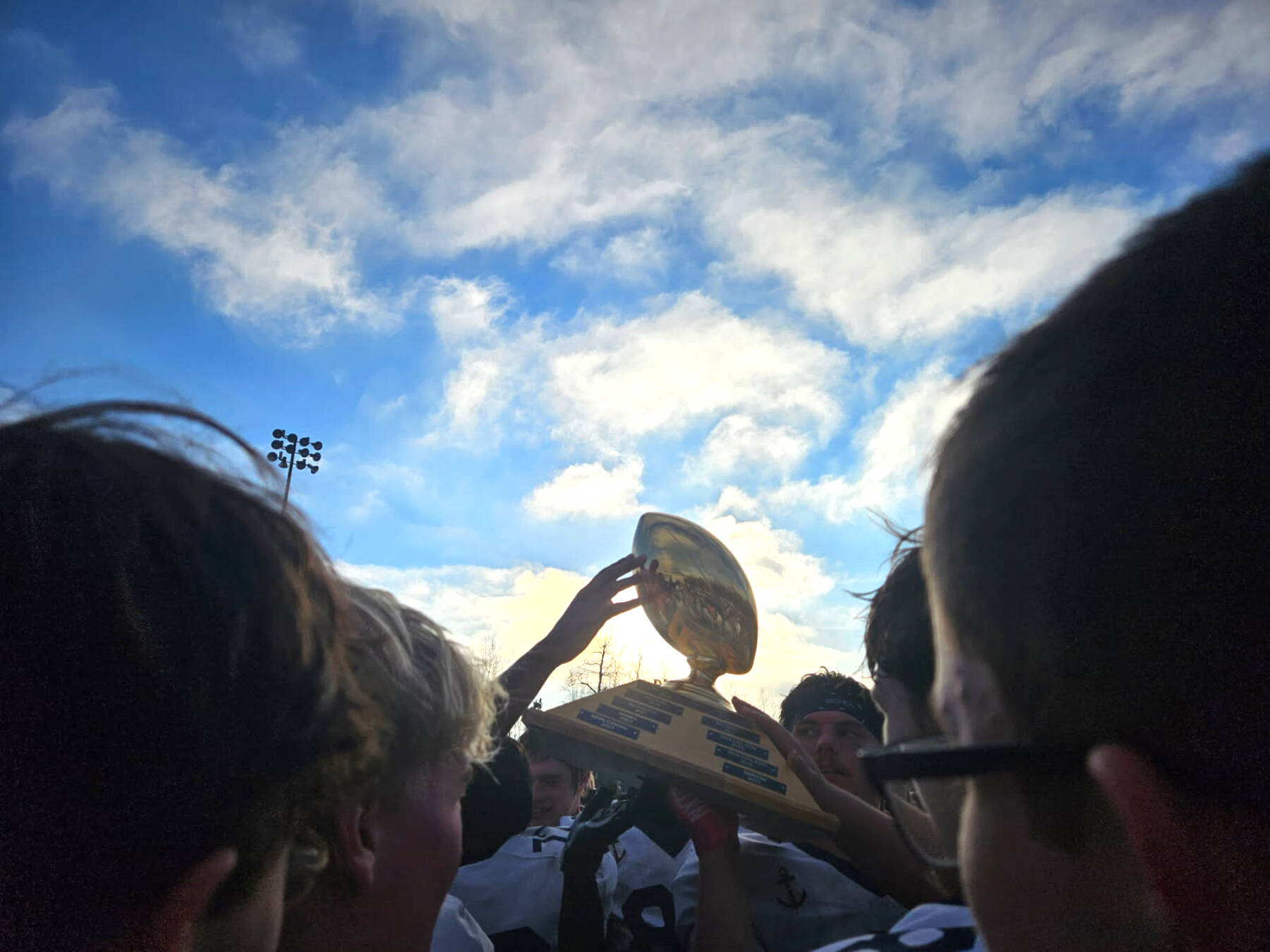 The Homer Mariners varsity football team celebrates their victory after the Division III state championships game on Saturday, Oct. 18, 2025, in Wasilla, Alaska. Photo provided by Justin Zank