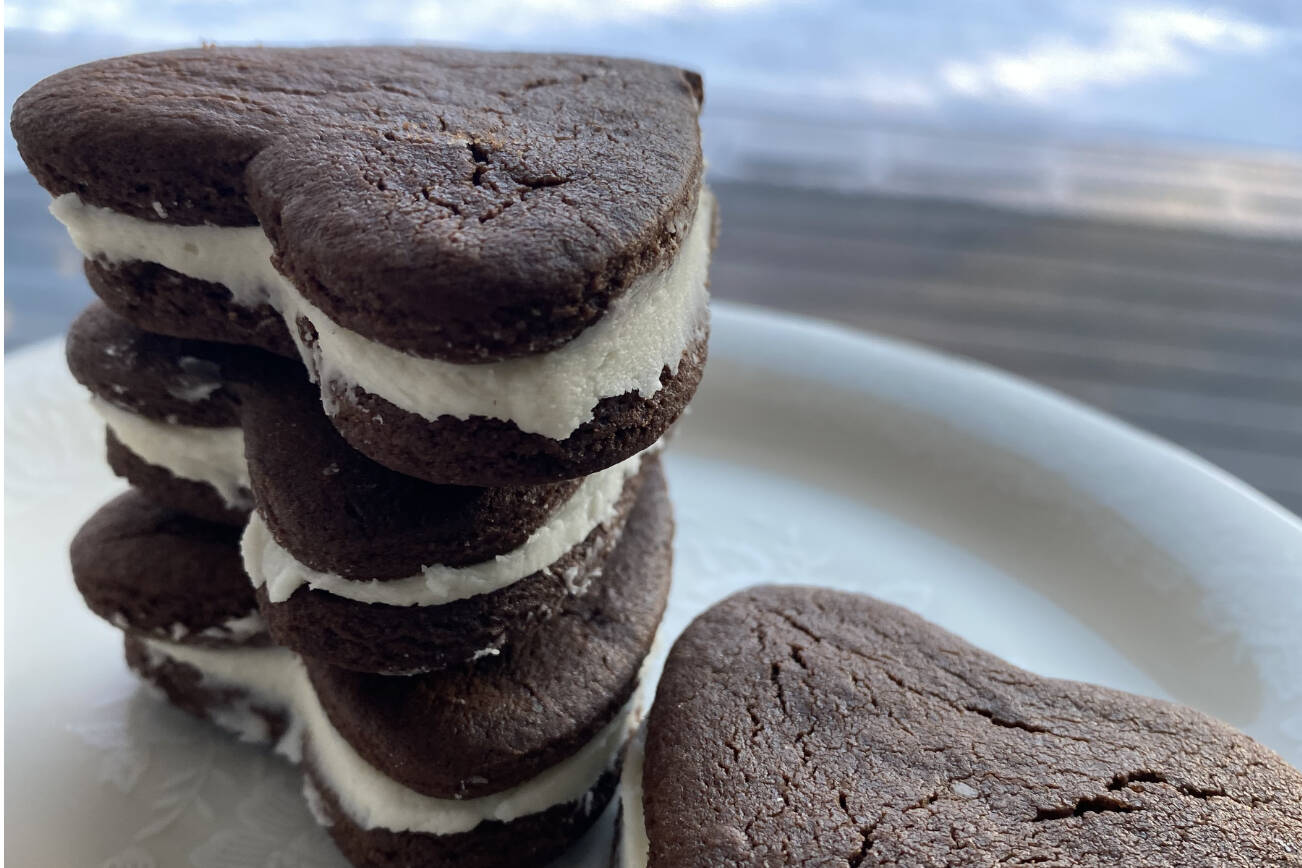 These heart-shaped chocolate sandwich cookies go perfectly with a glass of milk. (Photo by Tressa Dale/Peninsula Clarion)