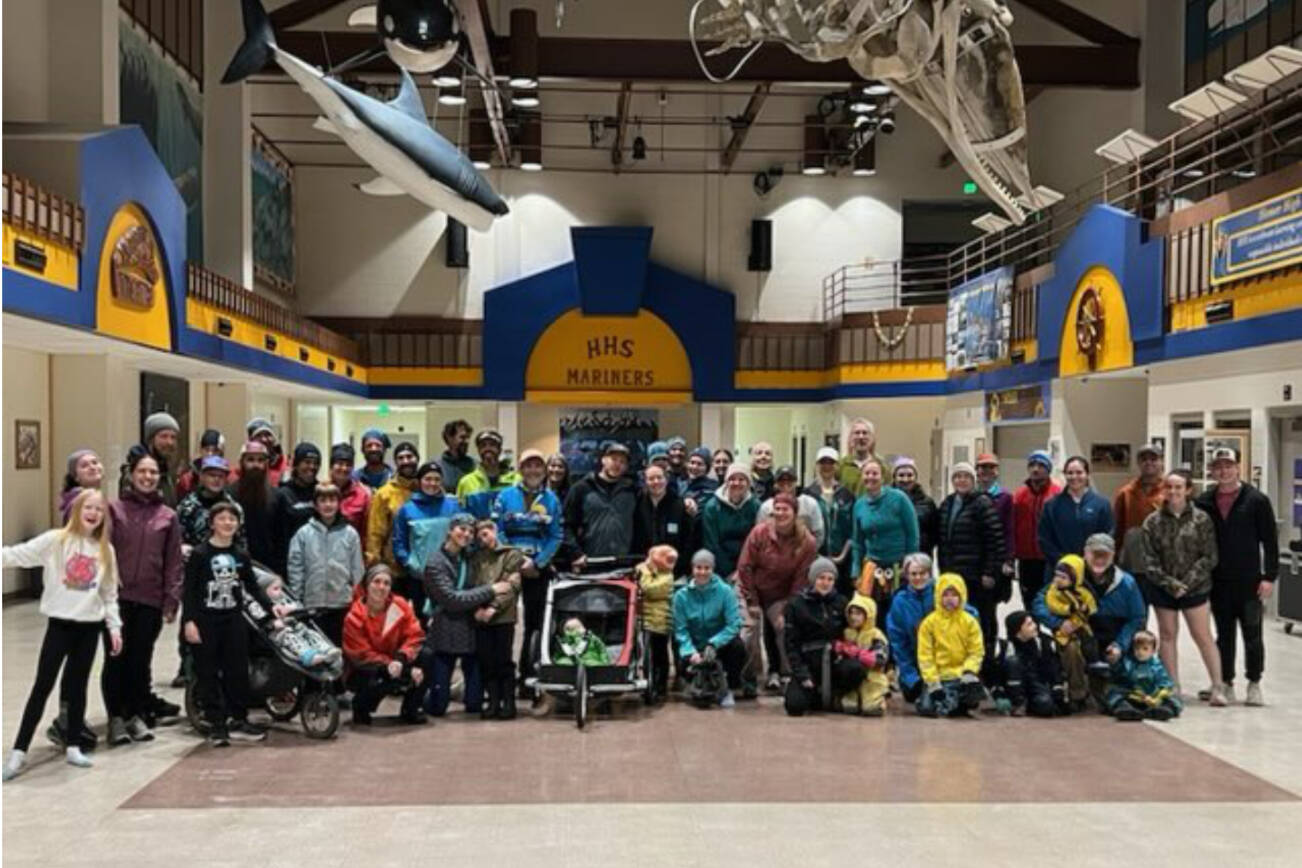 Runners of all ages gather for a photo in the Homer High School Commons after the annual Thanksgiving Turkey Trot on Thursday, Nov. 27, 2025, in Homer, Alaska. Due to icy outdoor conditions, the official run was moved to the high school halls. Photo courtesy Matthew Smith
