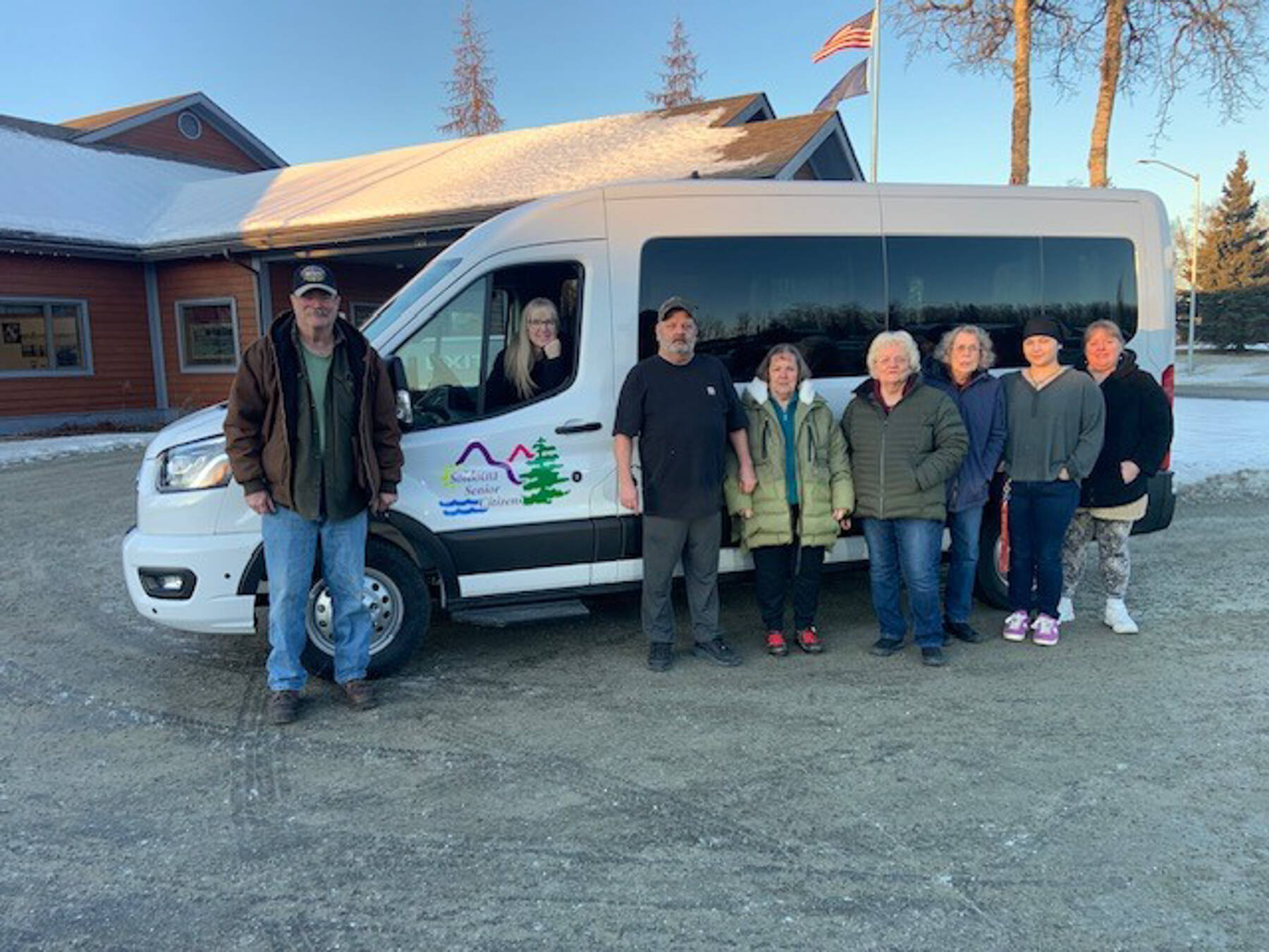 Staff at Soldotna Senior Citizens, Inc. are photographed on Dec. 17<ins>, 2025,</ins> in Soldotna<ins>, Alaska,</ins> in front of a new 15-passenger van purchased with funds the Rasmuson Foundation and several local businesses donated to the nonprofit organization. Photo courtesy of Soldotna Senior Citizens, Inc.