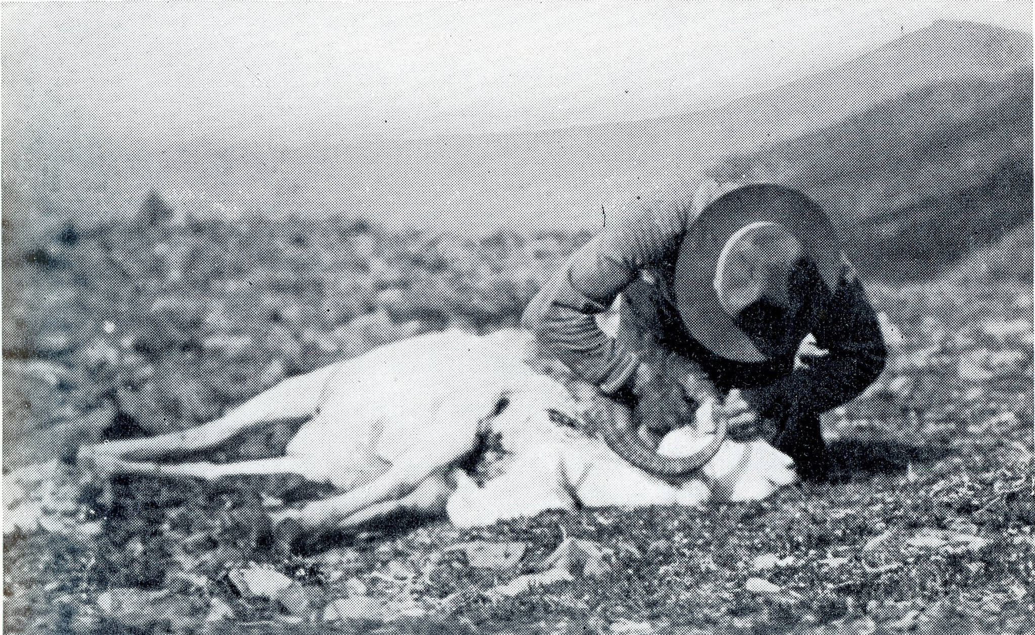This image is the only confirmed photograph of guide Ben Swesey discovered by the author. The photo, from John P. Holmans 1933 hunting memoir, Sheep and Bear Trails, shows Swesey working to remove the cape from a Dall sheep ram shot by Holman in 1917.