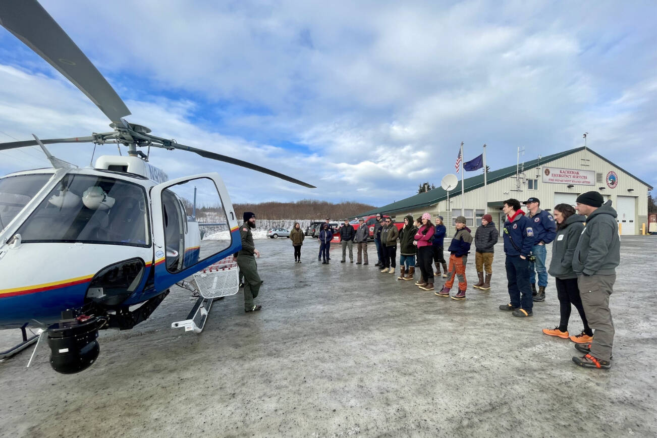 Members of the Kachemak Bay Search and Rescue group receive instruction from helicopter pilot Steven Ritter (left) on Jan. 30, 2026, during a training weekend at Kachemak Emergency Services station in Homer, Alaska. Photo courtesy Kasey Aderhold