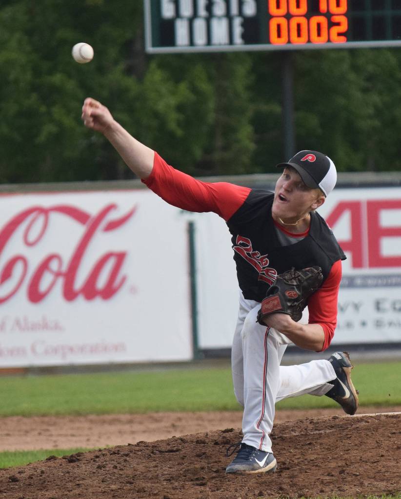 Peninsula Oilers pitcher Ryan Silva delivers a throw to a Chugiak/Eagle River Chinooks batter Friday night at Coral Seymour Memorial Park in Kenai. (Photo by Joey Klecka/Peninsula Clarion)