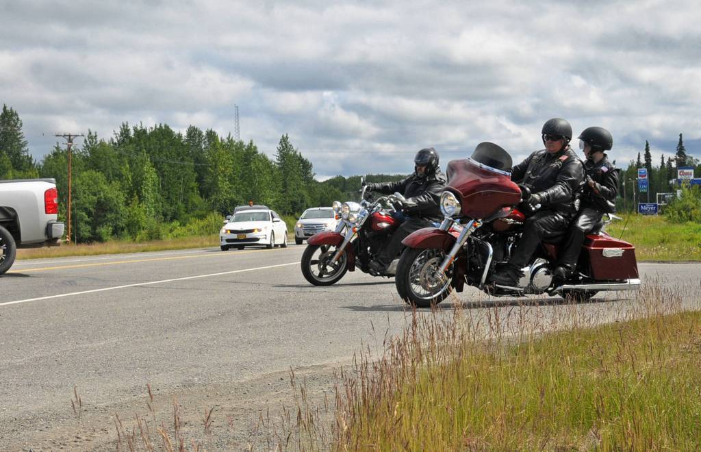 Motorcyclists take off as part of a procession to Travis Stubblefields memorial service from the driveway of the Harley-Davidson Motorcycles store on Saturday, June 30, 2018 in Soldotna, Alaska. Stubblefield, a lifelong resident of the Soldotna area, was killed June 21 in a conflict in Kasilof. Alaska State Troopers are investigating the circumstances of his death, though no charges have yet been filed. (Photo by Elizabeth Earl/Peninsula Clarion)