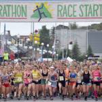The womens field takes to the course Tuesday, July 4, 2017, at Mount Marathon in Seward. Eventual winner Allie Ostrander is to the right of Christy Marvin (1). (Photo by Jeff Helminiak/Peninsula Clarion)