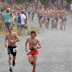 Eventual champion David Norris of Anchorage and eventual runner-up Max King of Bend, Oregon, leave the rest of the field in the dust during the road portion of the Mount Marathon Race on Wednesday, July 4, 2018, in Seward. (Photo by Jeff Helminiak/Peninsula Clarion)