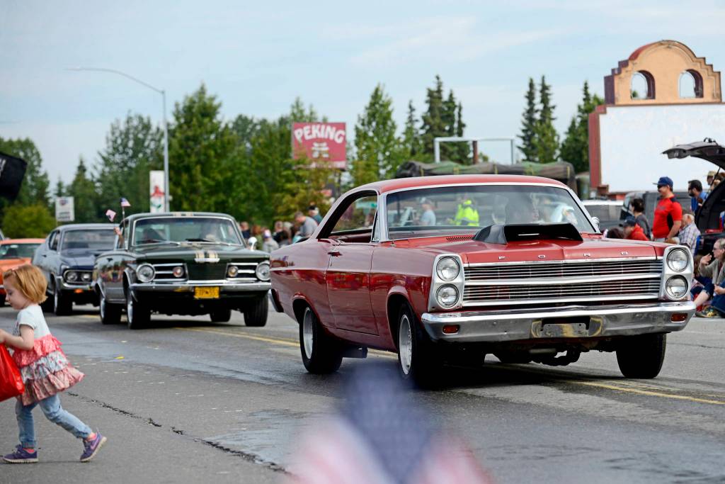 Members of the Kaknu Kruzers Car Club drive down Main Street Loop in Kenais Fourth of July parade on Wednesday, July 4, 2018 in Kenai, Alaska (Ben Boettger/Peninsula Clarion)