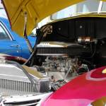 A restored classic car owned by Irv Carlisle sits in a parking lot alongside other restored classic cars at a Kaknu Kruzers car show at Autozone on Saturday, June 30, 2018 in Soldotna, Alaska. The Kaknu Kruzers, a local club composed of members who restore classic cars, will participate in a number of parades and shows this summer, including Soldotnas Progress Days parade on July 28. (Photo by Elizabeth Earl/Peninsula Clarion)