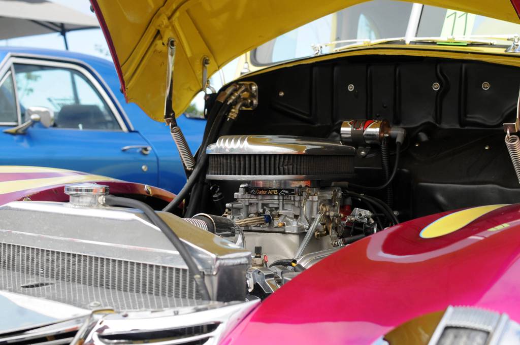 A restored classic car owned by Irv Carlisle sits in a parking lot alongside other restored classic cars at a Kaknu Kruzers car show at Autozone on Saturday, June 30, 2018 in Soldotna, Alaska. The Kaknu Kruzers, a local club composed of members who restore classic cars, will participate in a number of parades and shows this summer, including Soldotnas Progress Days parade on July 28. (Photo by Elizabeth Earl/Peninsula Clarion)