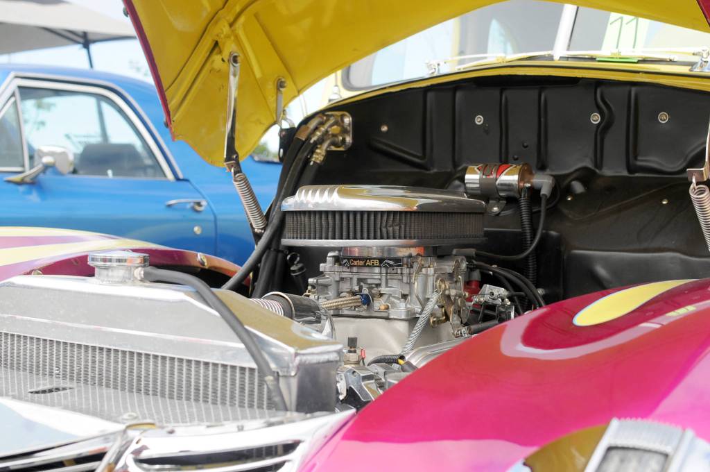 A restored classic car owned by Irv Carlisle sits in a parking lot alongside other restored classic cars at a Kaknu Kruzers car show at Autozone on Saturday, June 30, 2018 in Soldotna, Alaska. The Kaknu Kruzers, a local club composed of members who restore classic cars, will participate in a number of parades and shows this summer, including Soldotnas Progress Days parade on July 28. (Photo by Elizabeth Earl/Peninsula Clarion)