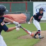 Jeremy Kupferschmid eyes teammate Harrison Metz at the plate Friday afternoon against Dimond at Coral Seymour Memorial Ballpark. (Photo by Joey Klecka/Peninsula Clarion)