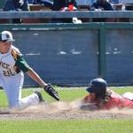 Service third baseman Henry Helgeson (20) loses the ball while attempting to tag Twins baserunner David Michael, Tuesday afternoon at Coral Seymour Memorial Ballpark in Kenai. (Photo by Joey Klecka/Peninsula Clarion)