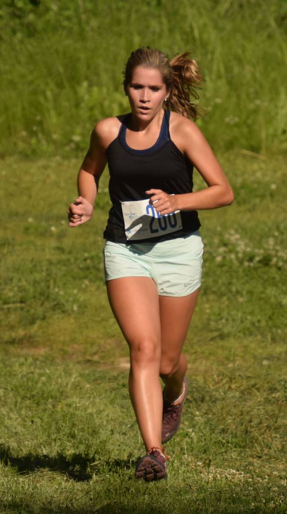 Tanis Lorring gets ready to win the womens five-kilometer race Wednesday, July 18, 2018, at the Salmon Run Series at Tsalteshi Trails. (Photo by Jeff Helminiak/Peninsula Clarion)